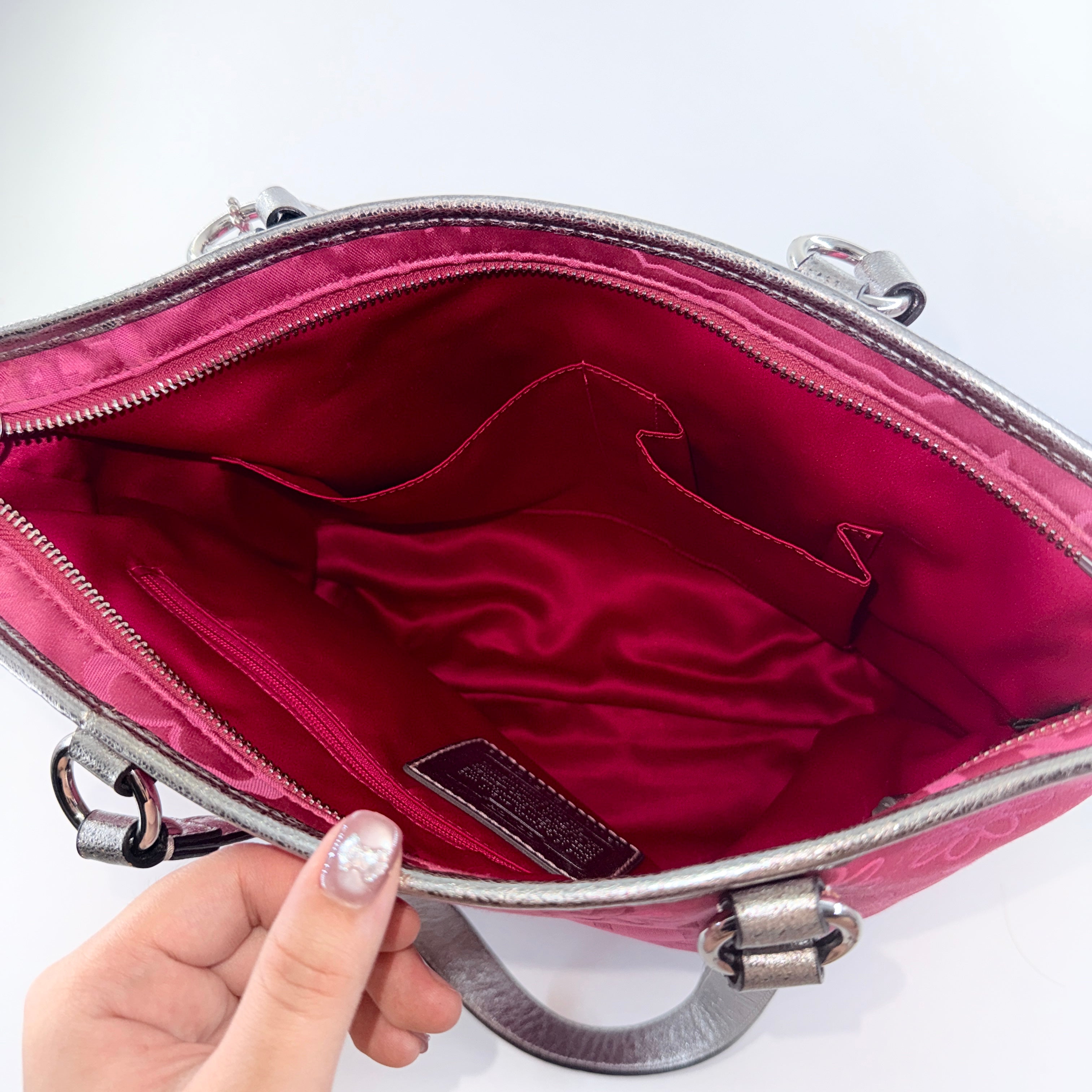 Coach Poppy Bandana Glitter Graffiti Tote Bag in vibrant pink with metallic silver handles, adorned with glitter accents and butterfly charm.
