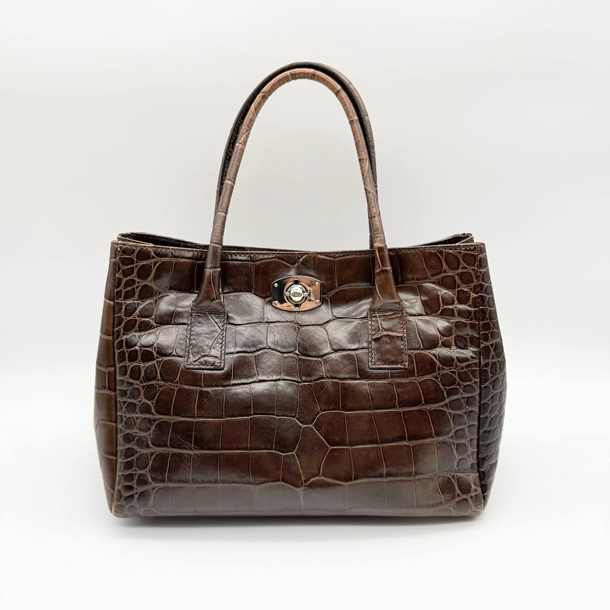 Furla dark brown croc-embossed leather handbag with silver-tone hardware and double top handles, photographed against a clean white background.