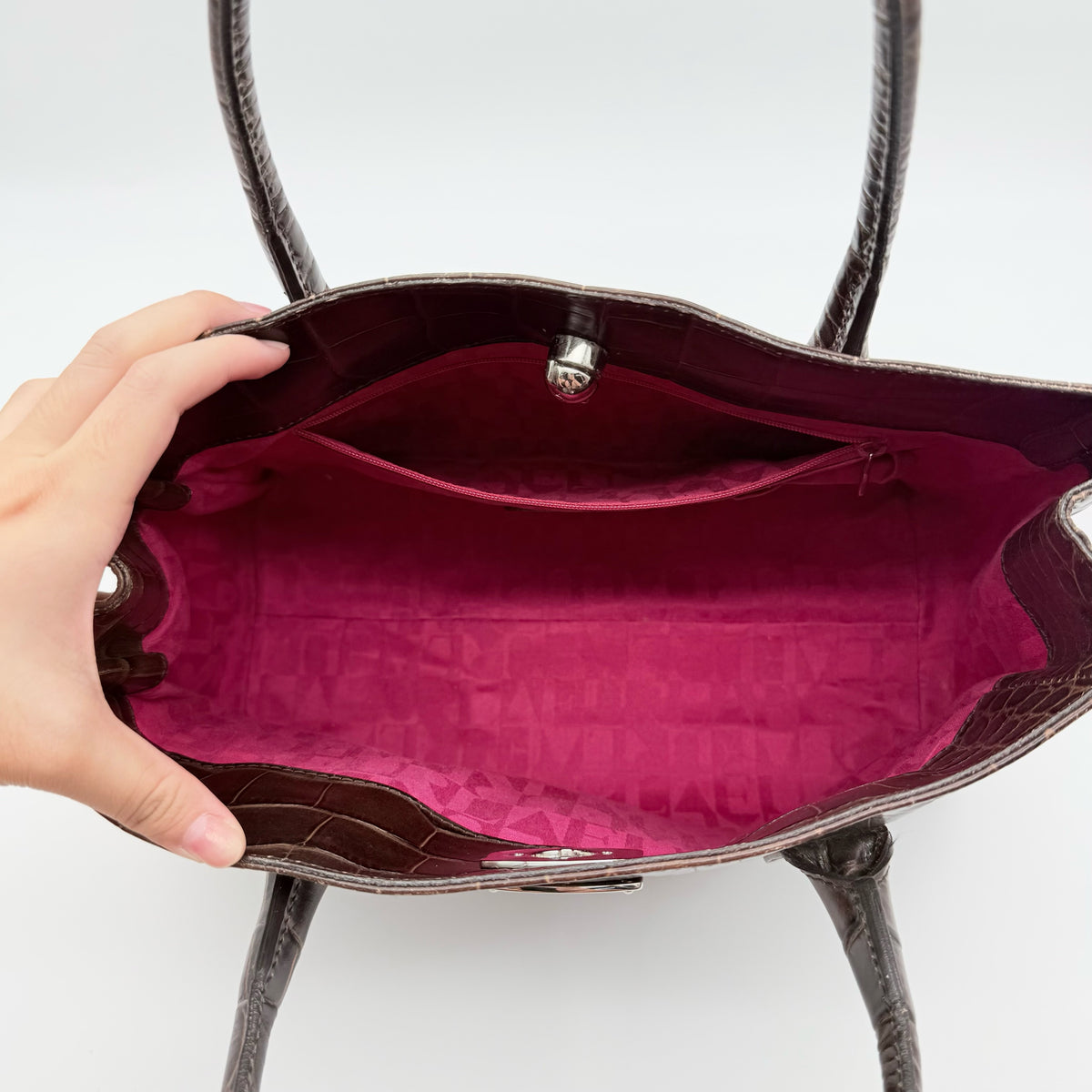 Furla dark brown croc-embossed leather handbag with silver-tone hardware and double top handles, photographed against a clean white background.