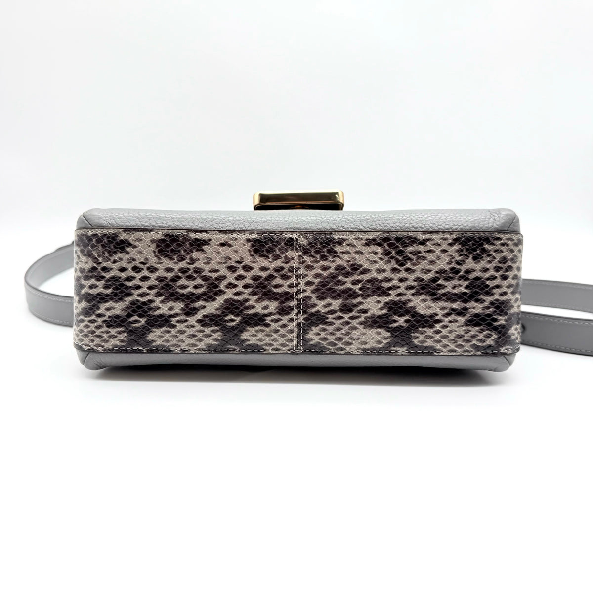 Coach Grace grey pebbled leather shoulder bag with python-embossed sides and gold coach carriage hardware, styled with a long adjustable strap.