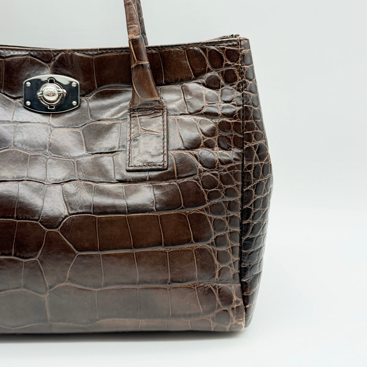 Furla dark brown croc-embossed leather handbag with silver-tone hardware and double top handles, photographed against a clean white background.
