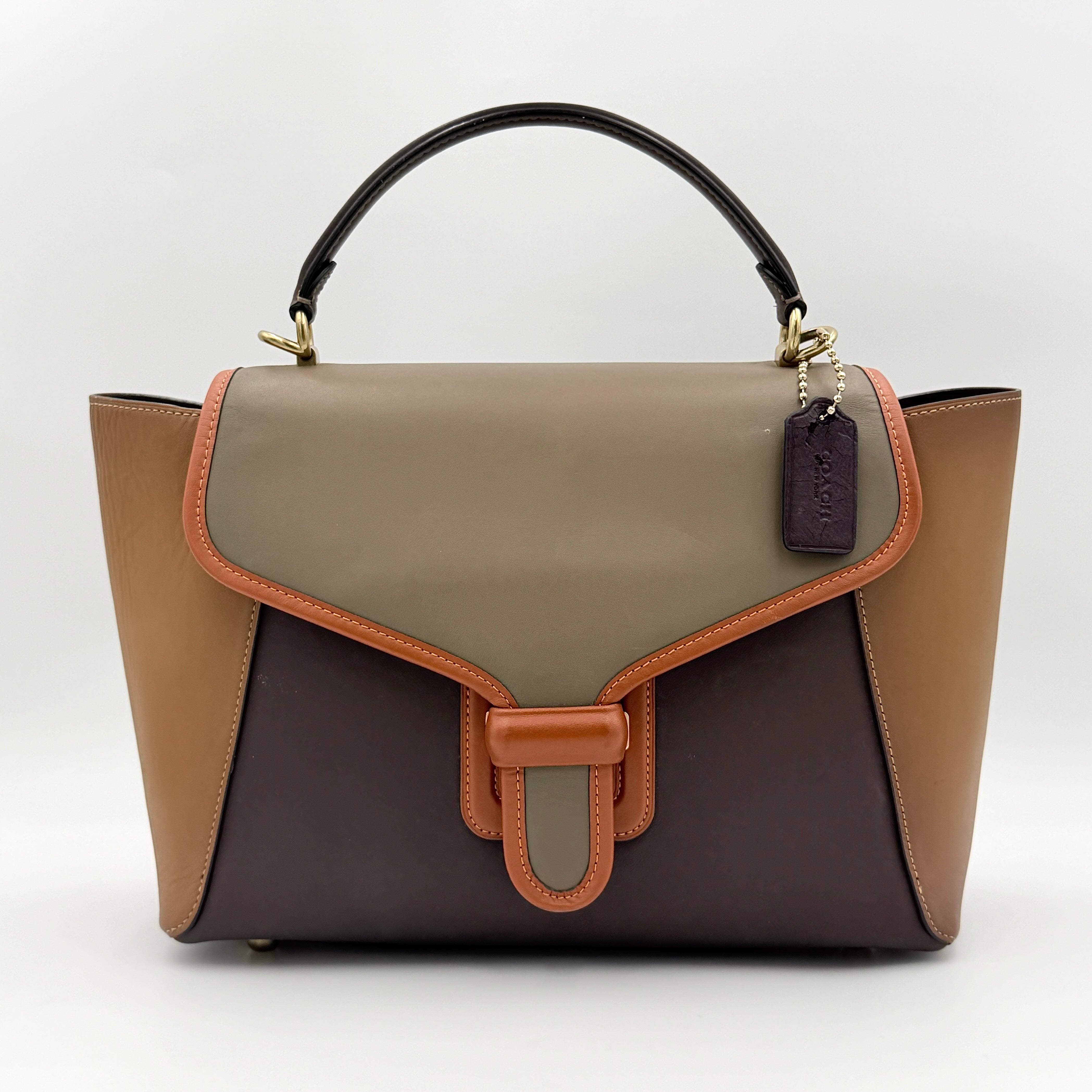 Coach 2Way Courier Carryall in brown and olive green colorblock leather with a structured silhouette, top handle, and detachable strap.