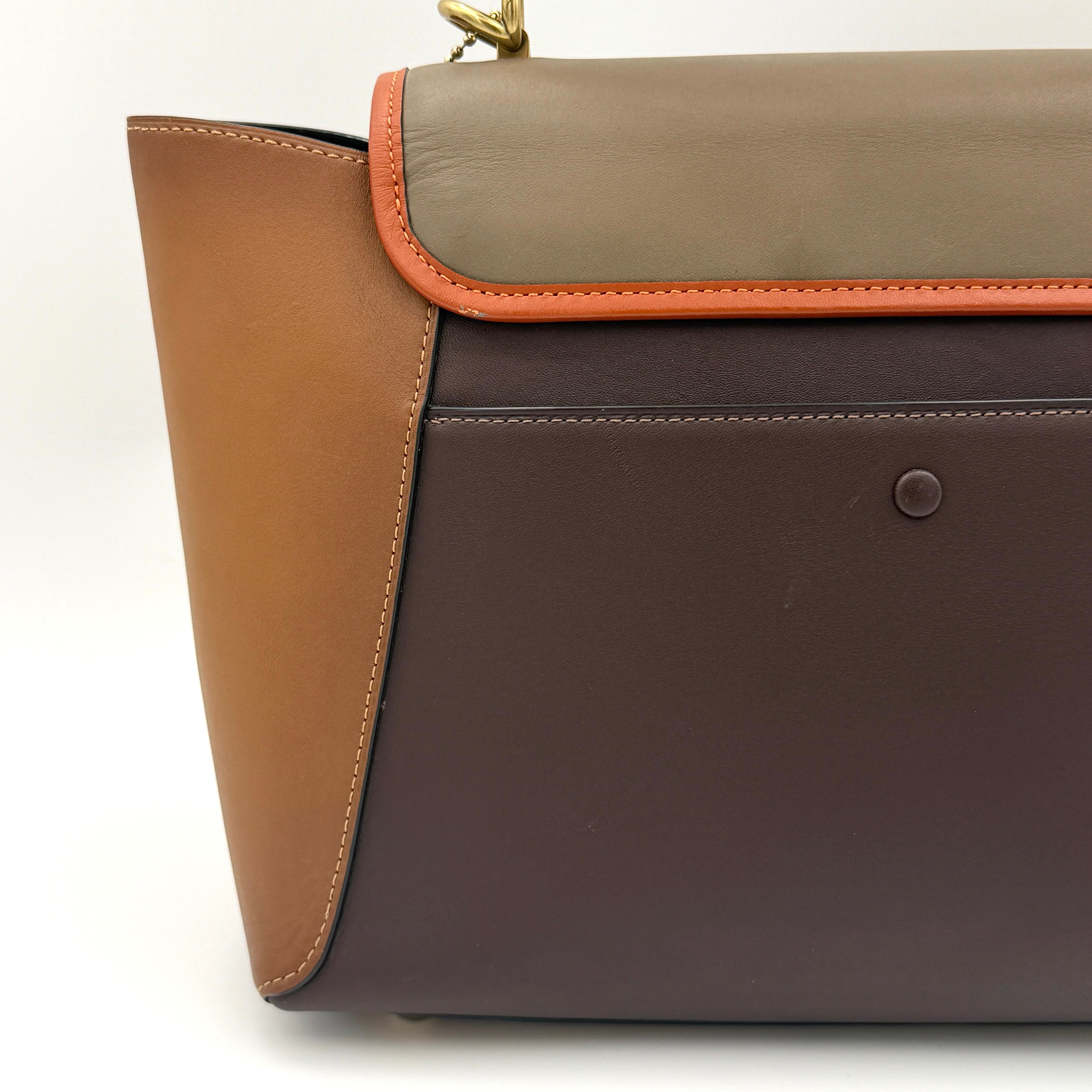Coach 2Way Courier Carryall in brown and olive green colorblock leather with a structured silhouette, top handle, and detachable strap.
