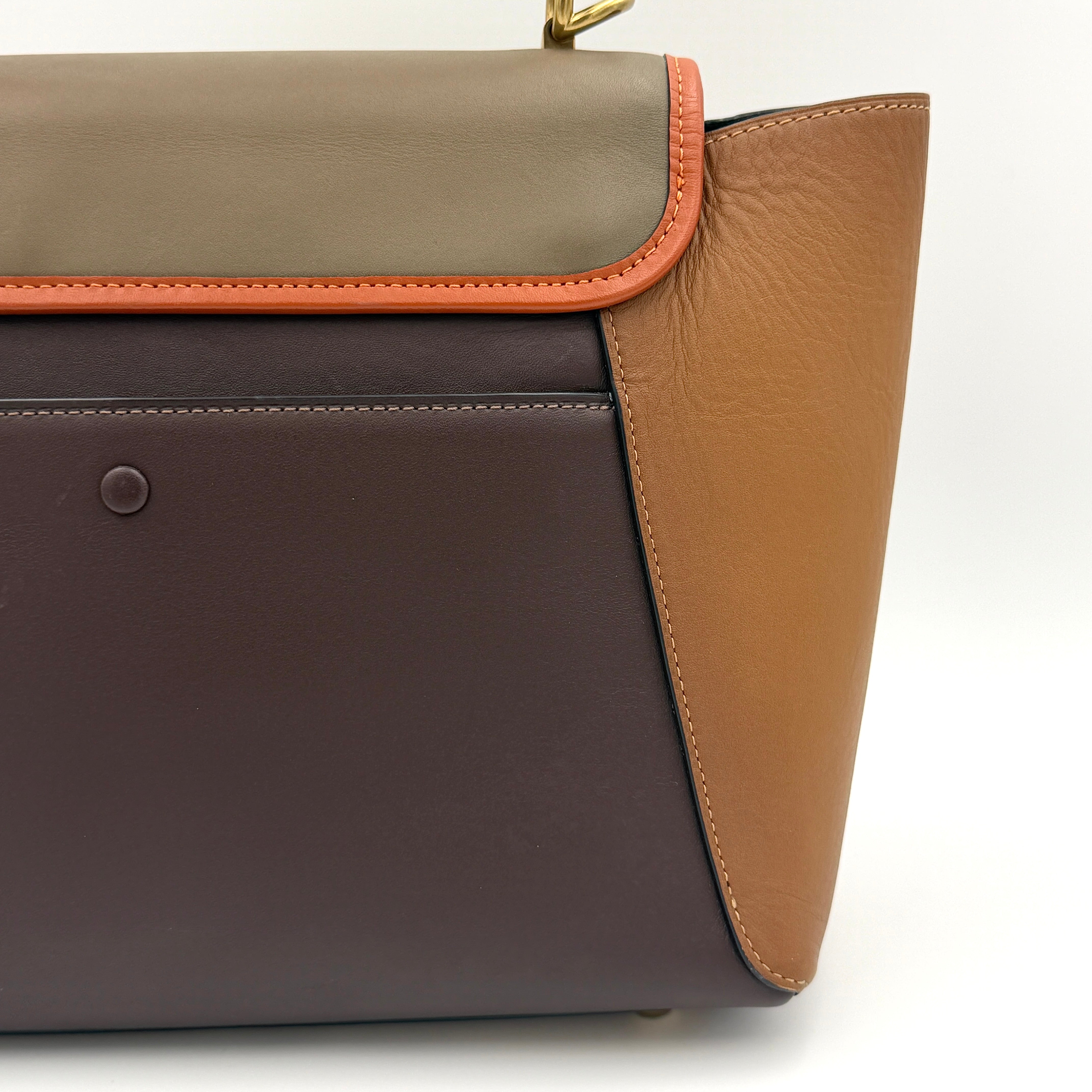 Coach 2Way Courier Carryall in brown and olive green colorblock leather with a structured silhouette, top handle, and detachable strap.