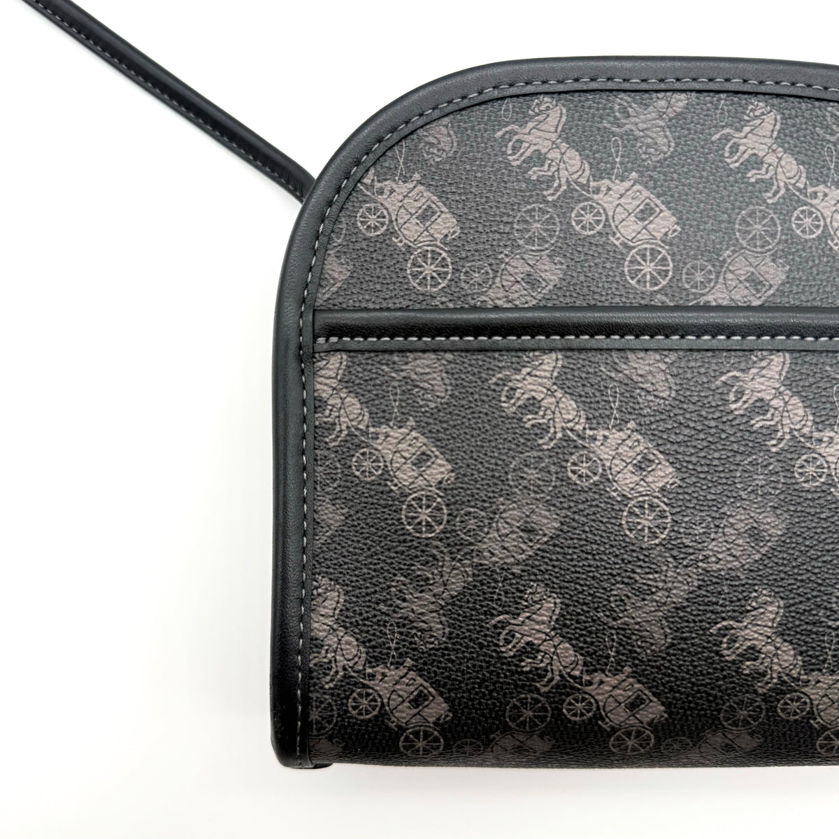 Coach Horse & Carriage Print Zip Crossbody Bag in black coated canvas with adjustable strap and gold hardware.