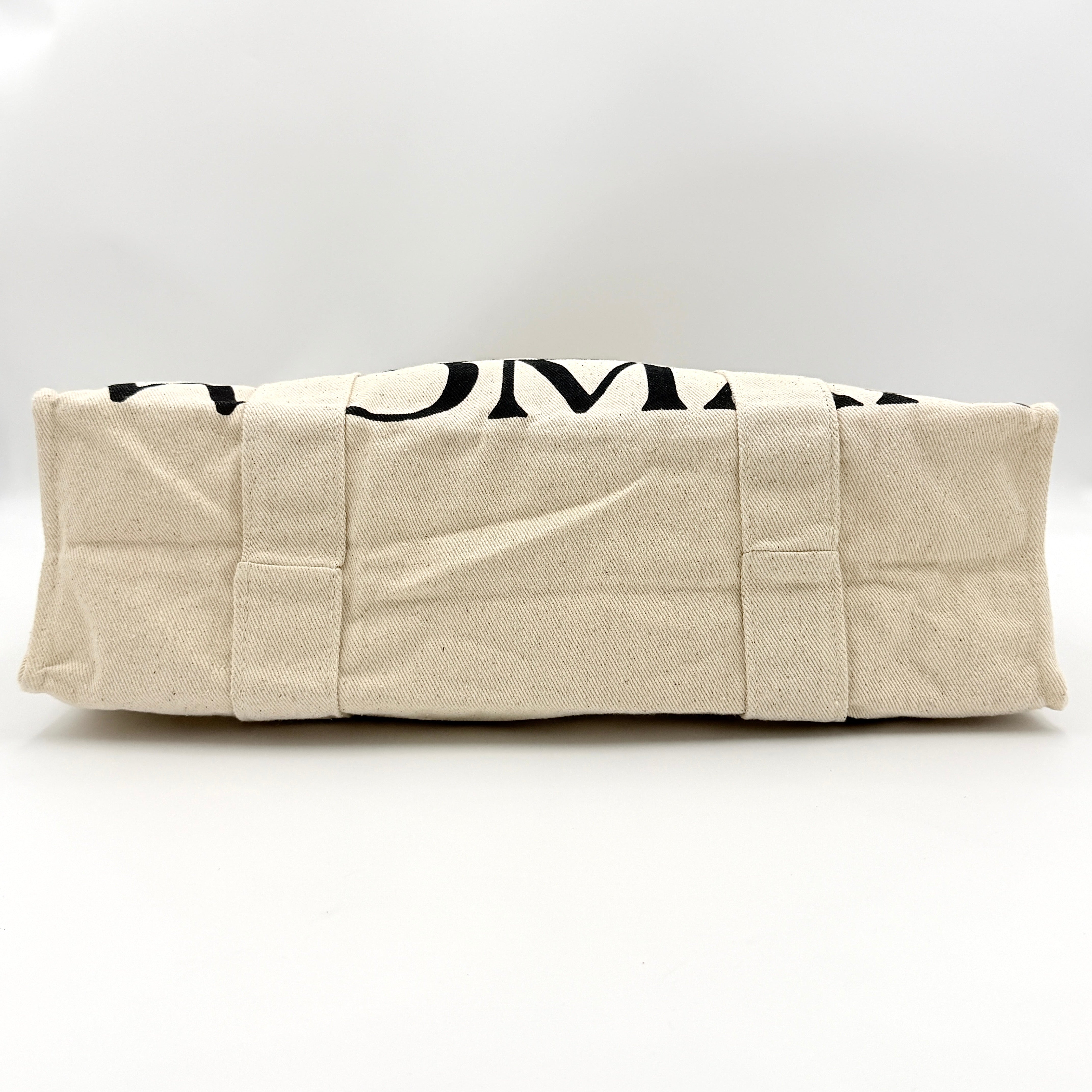 Gentlewoman Canvas Tote Bag in cream and black canvas with bold oversized logo and twin carry handles.
