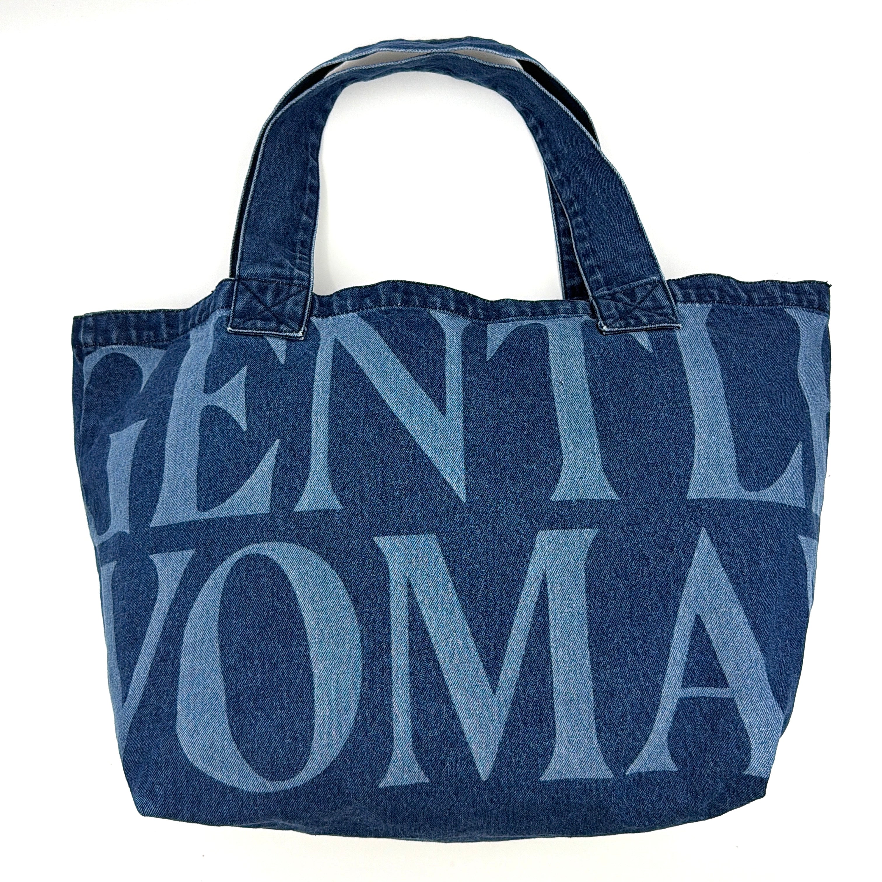 GENTLEWOMAN Jumbo Tote Bag in blue denim with oversized pale blue monogram, featuring sturdy twin handles.