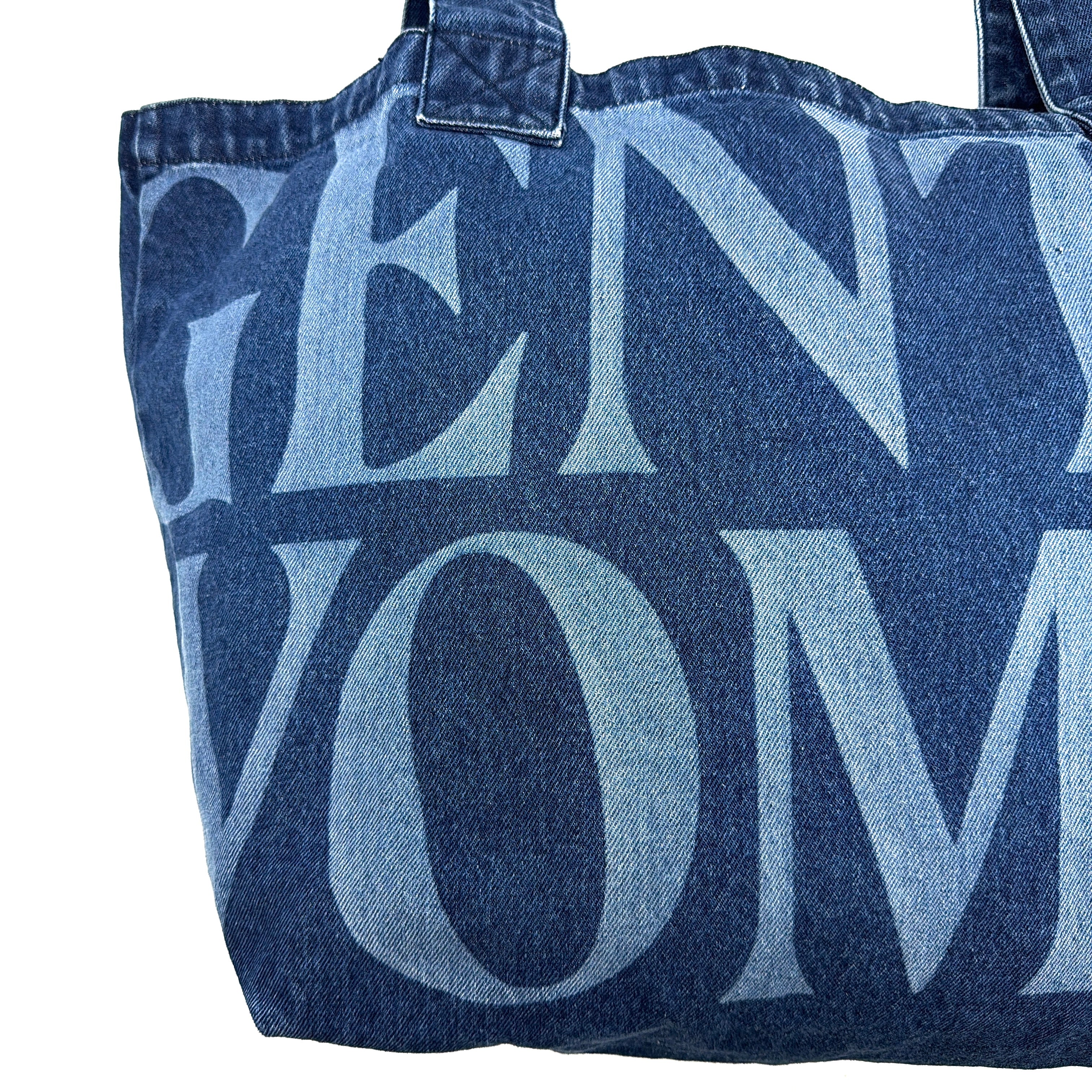 GENTLEWOMAN Jumbo Tote Bag in blue denim with oversized pale blue monogram, featuring sturdy twin handles.