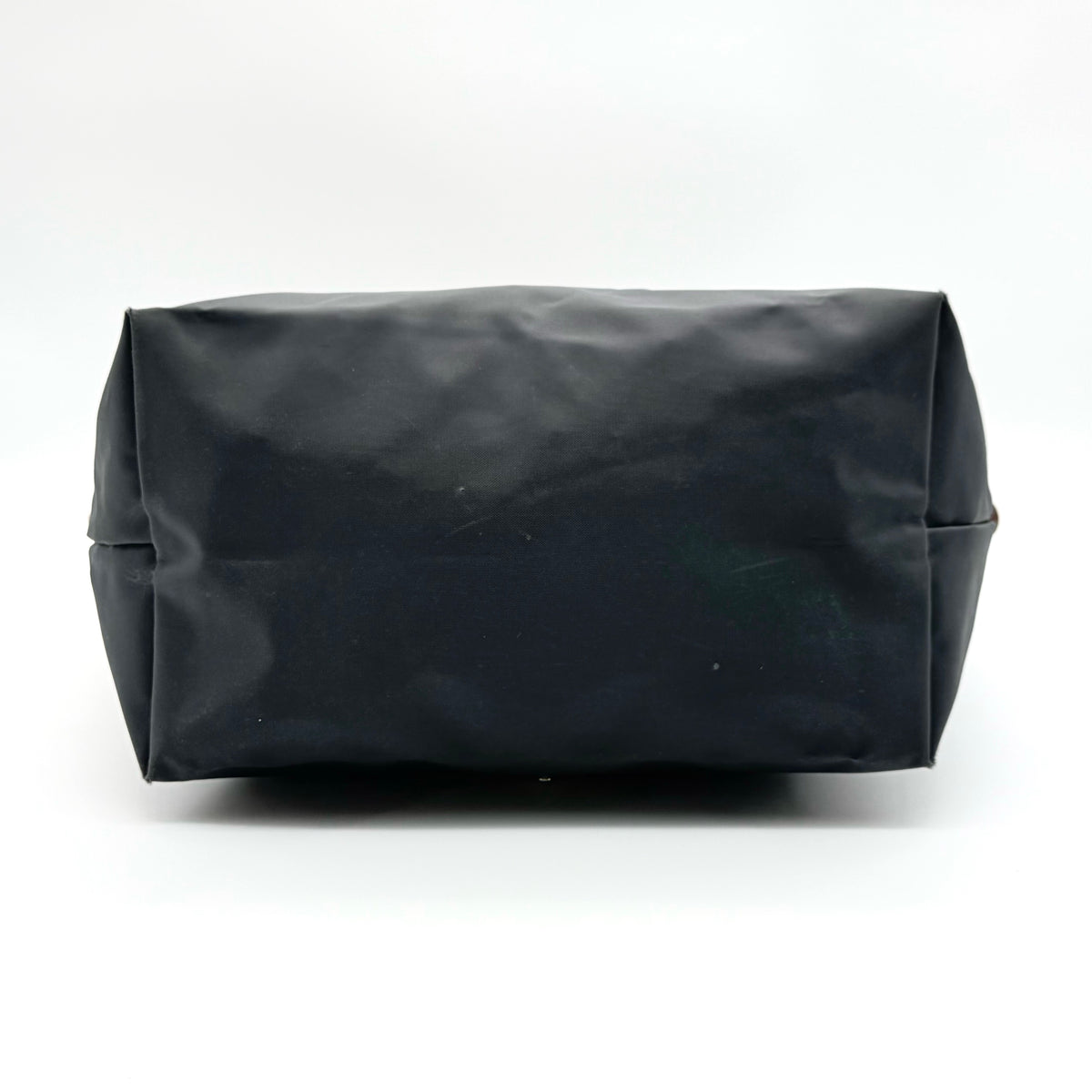 Longchamp Le Pliage Original Tote Bag in grey nylon with brown leather handles and flap, displayed against a white background.