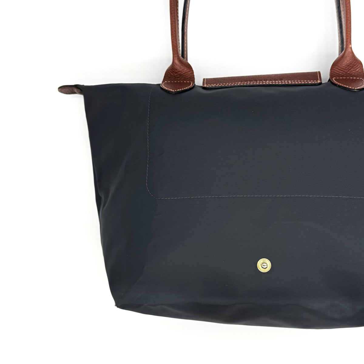 Longchamp Le Pliage Original Tote Bag in grey nylon with brown leather handles and flap, displayed against a white background.