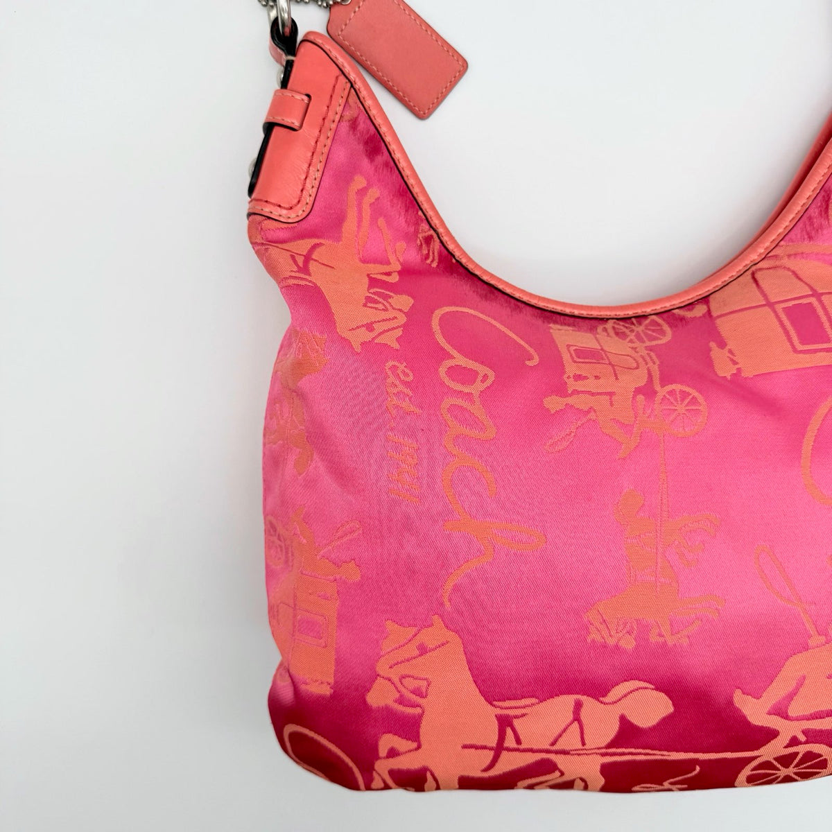 Coach pink and orange Horse & Carriage sateen hobo shoulder bag with detachable strap and leather trim.