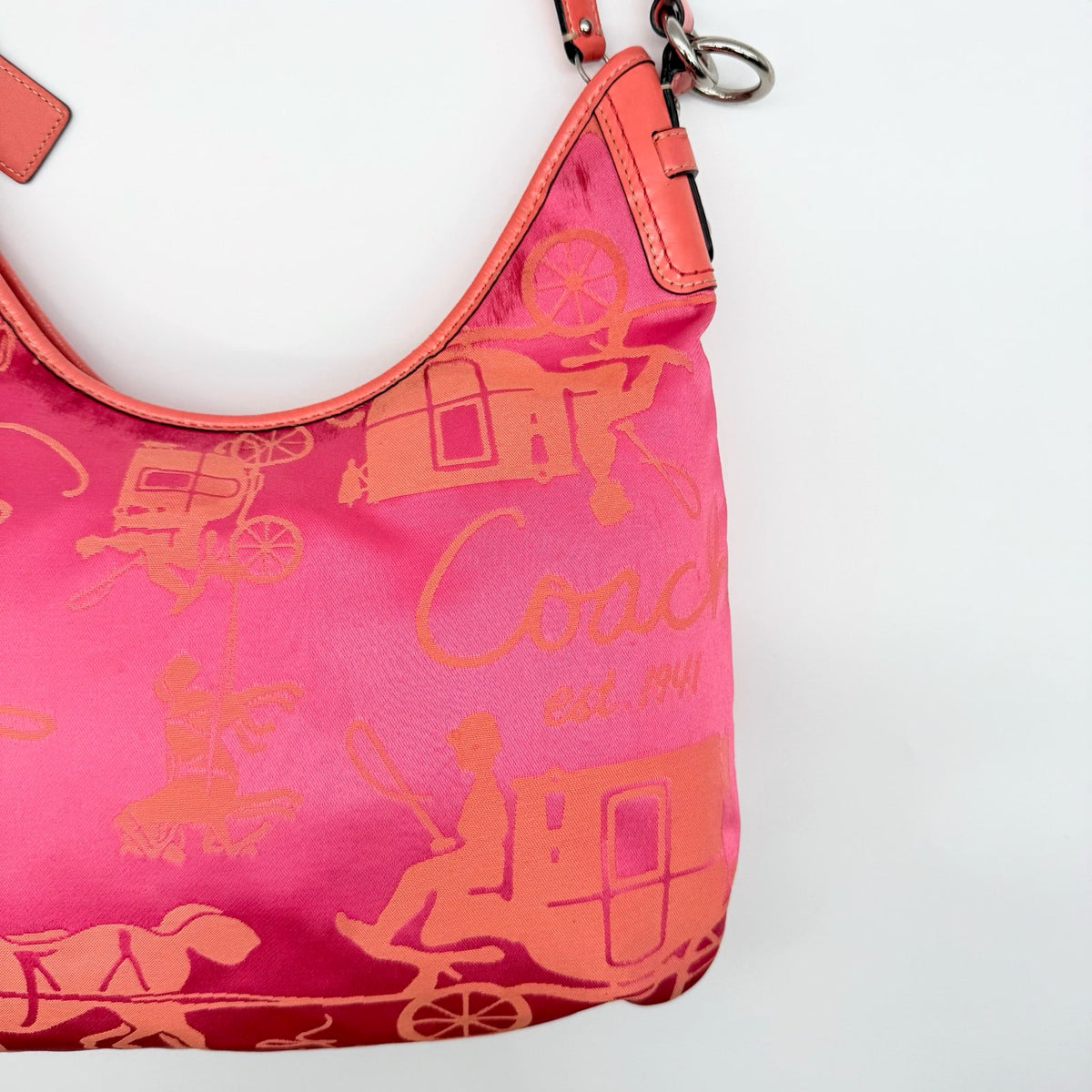 Coach pink and orange Horse & Carriage sateen hobo shoulder bag with detachable strap and leather trim.