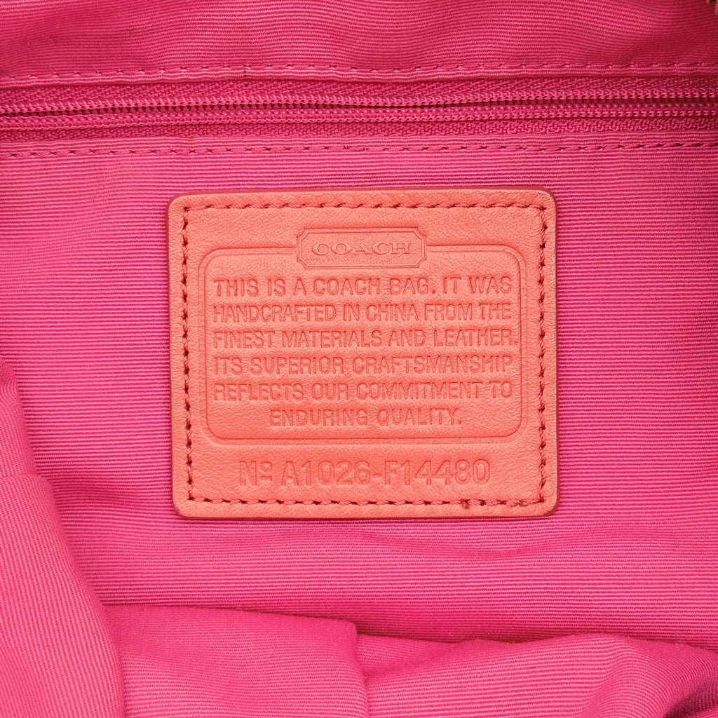 Coach pink and orange Horse & Carriage sateen hobo shoulder bag with detachable strap and leather trim.