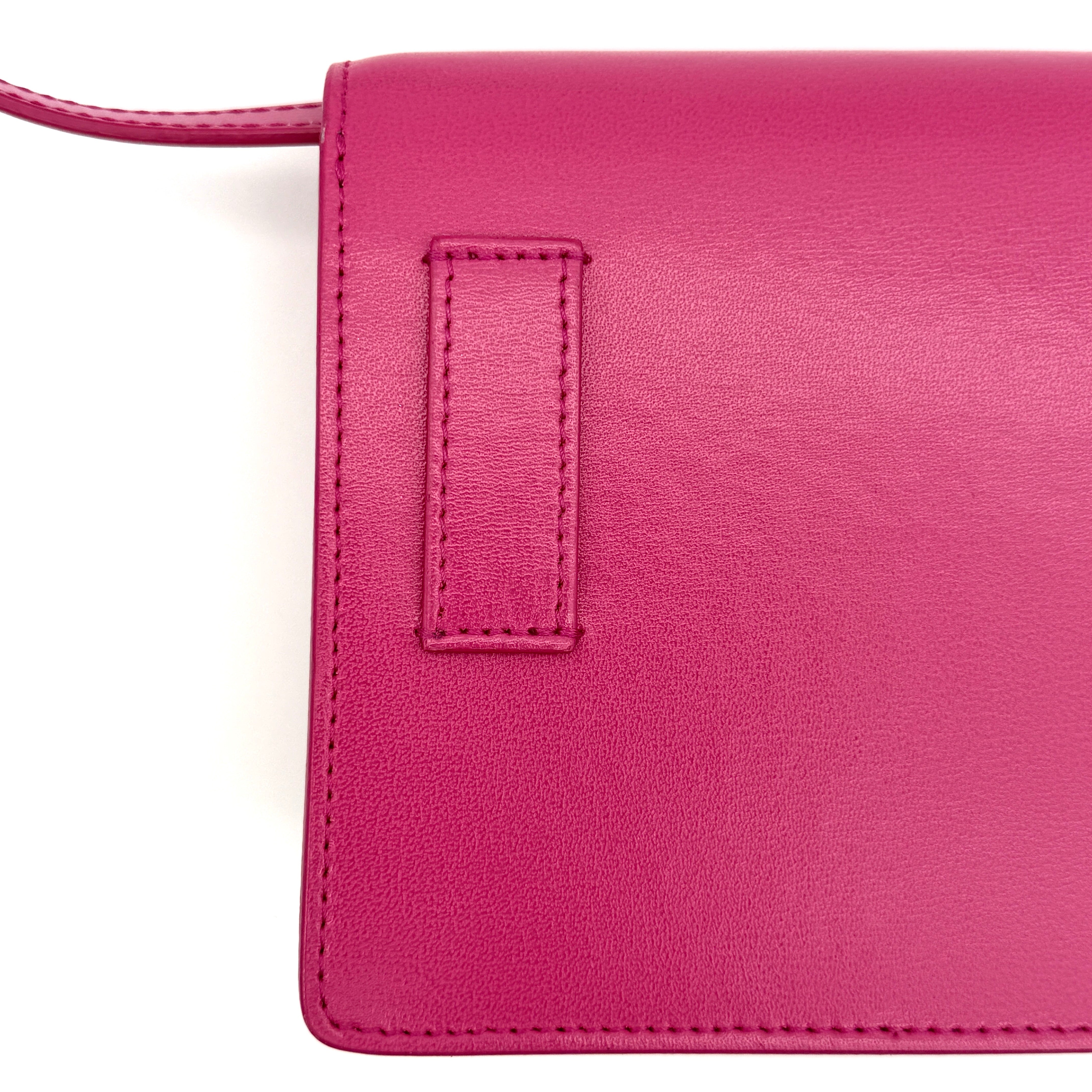 Off-White Jitney 0.7 Crossbody Bag in pink leather with silver-tone arrow logo and adjustable strap, shown against a white background.