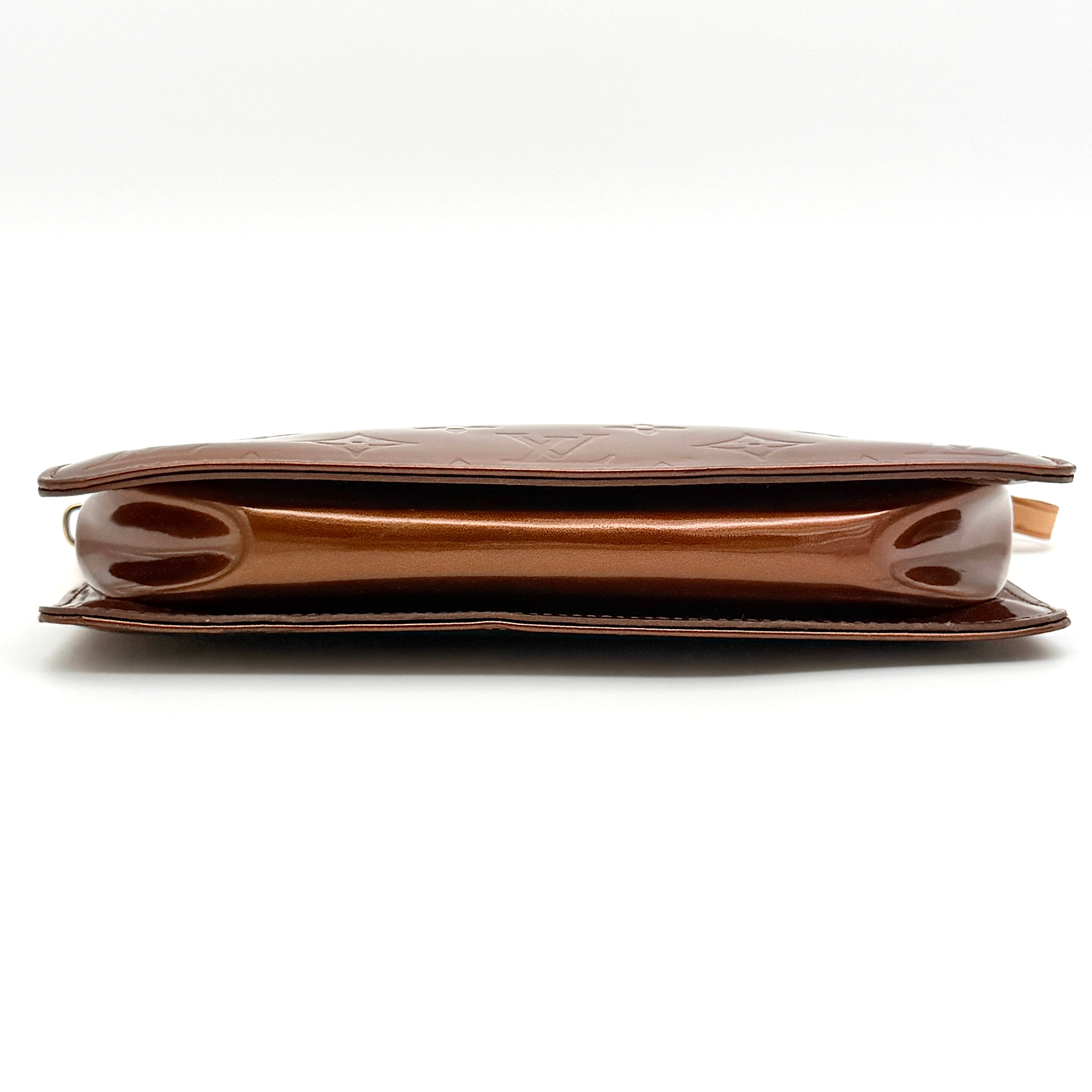 Louis Vuitton Monogram Lexington Vernis Pochette in bronze patent leather, shown with its gold-tone hardware and monogram embossing.