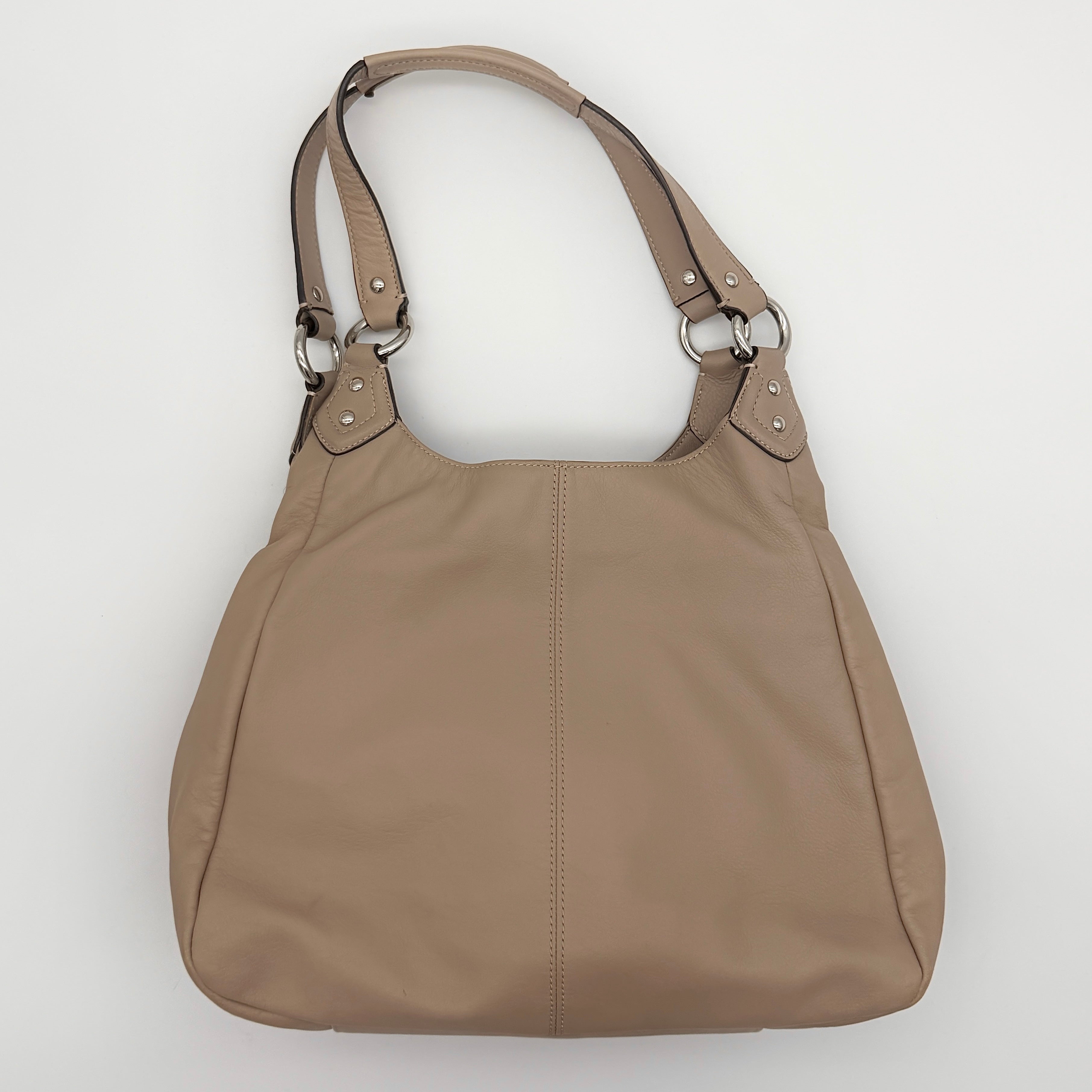 Coach Campbell Hobo shoulder bag in beige leather with silver hardware and front pocket, shown against a white background.