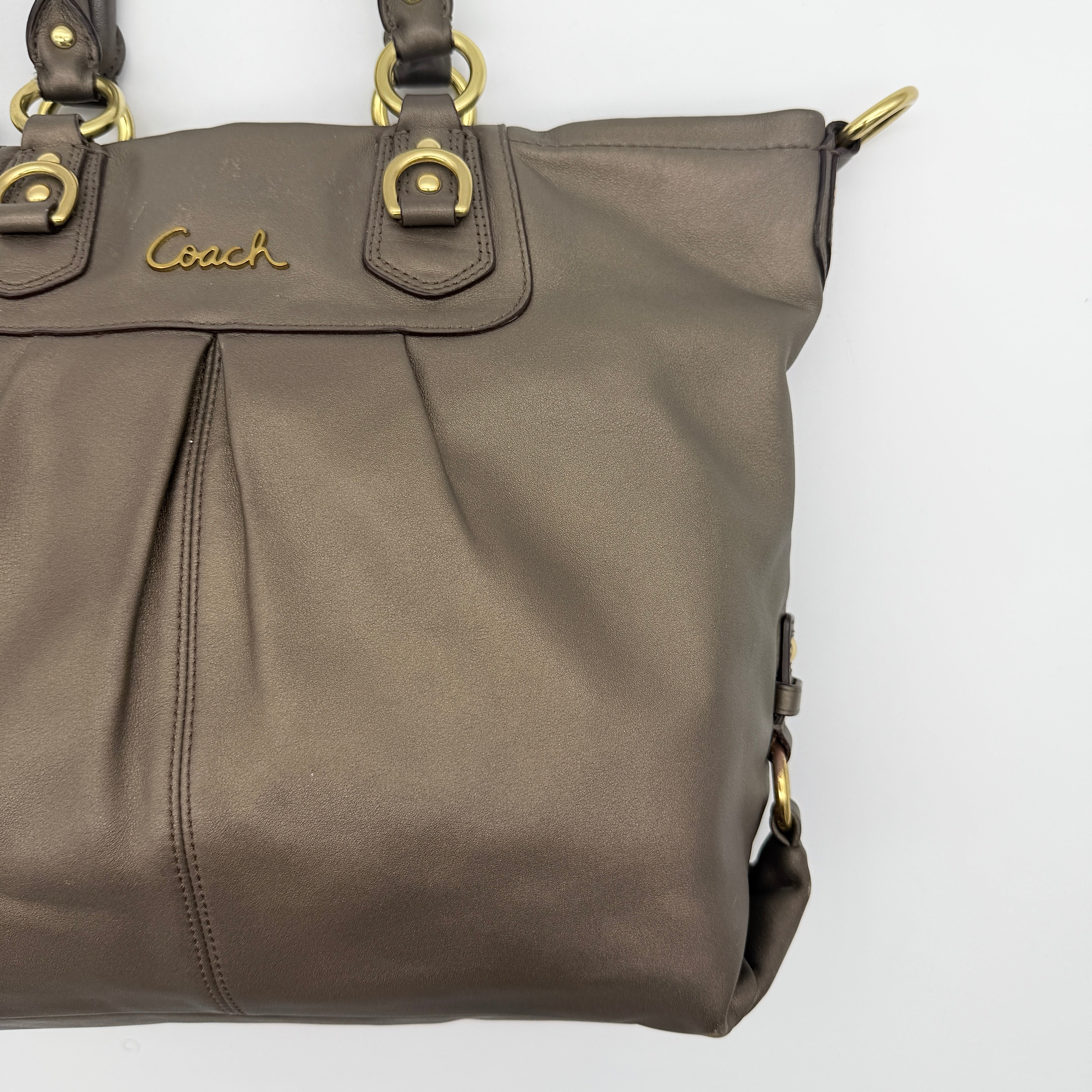 Coach Ashley 2Way shoulder bag in grey leather with gold-tone hardware and detachable strap, displayed against a white background.