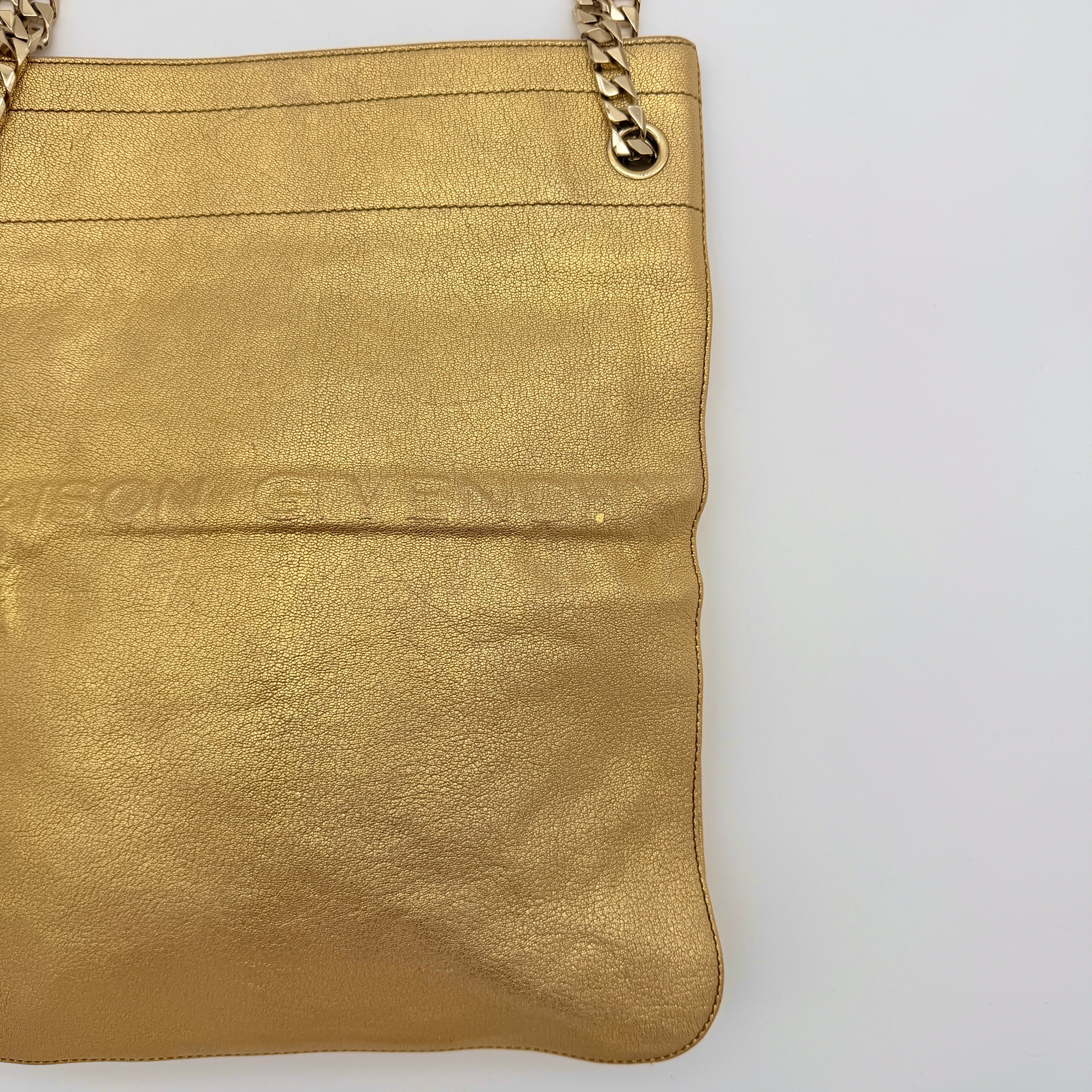 Givenchy metallic gold chain shoulder bag with gold-tone chain straps and embossed logo, displayed on a dust bag.
