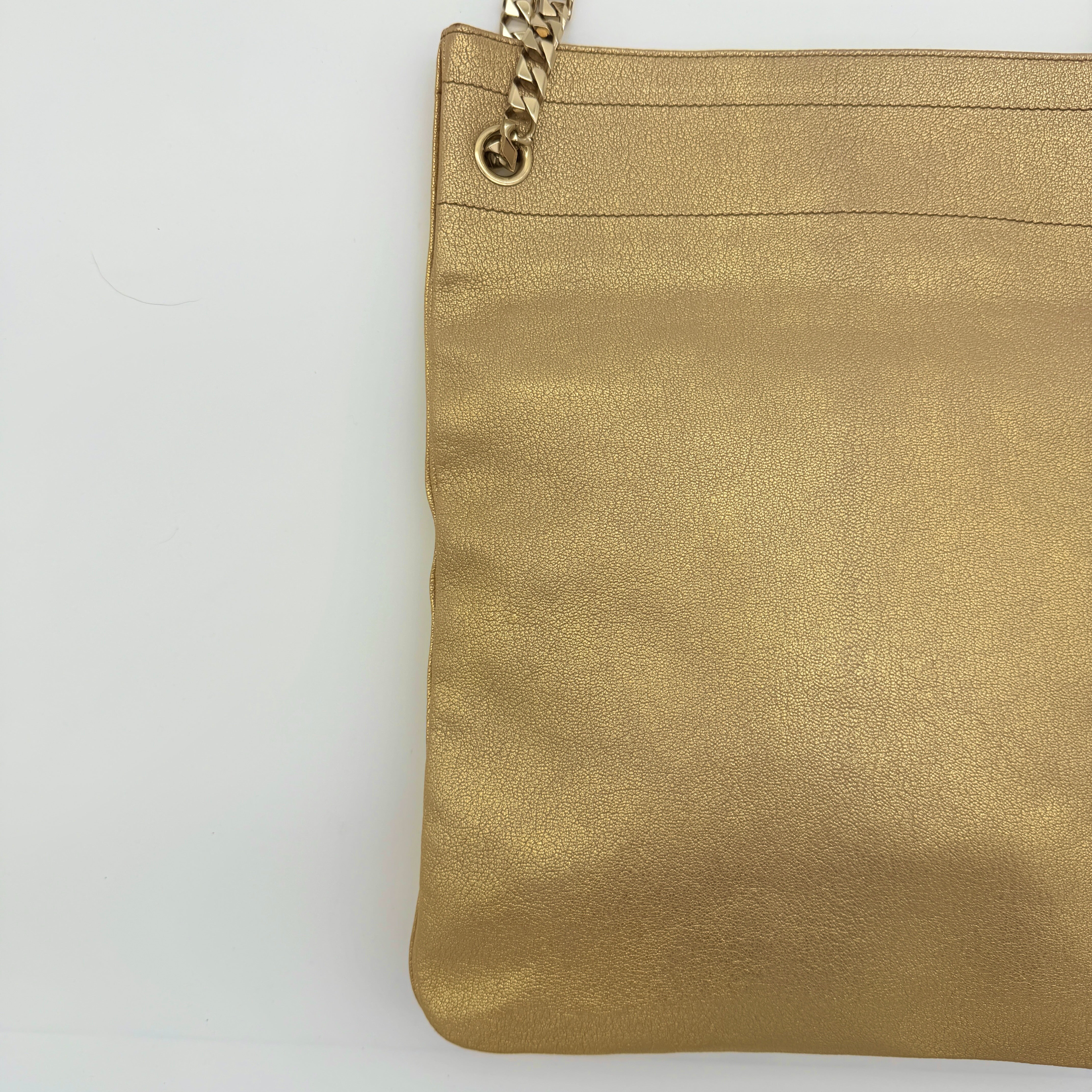 Givenchy metallic gold chain shoulder bag with gold-tone chain straps and embossed logo, displayed on a dust bag.