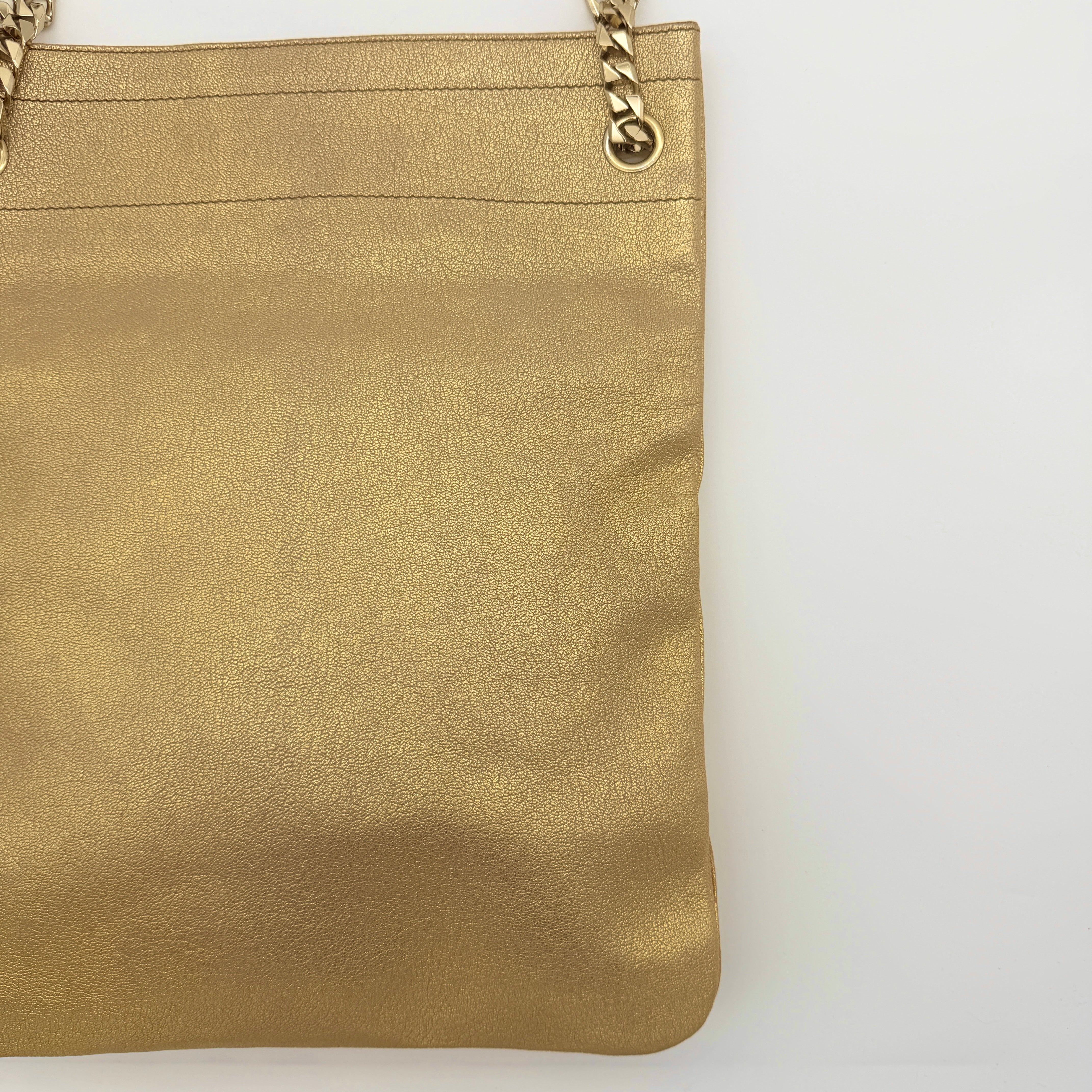Givenchy metallic gold chain shoulder bag with gold-tone chain straps and embossed logo, displayed on a dust bag.