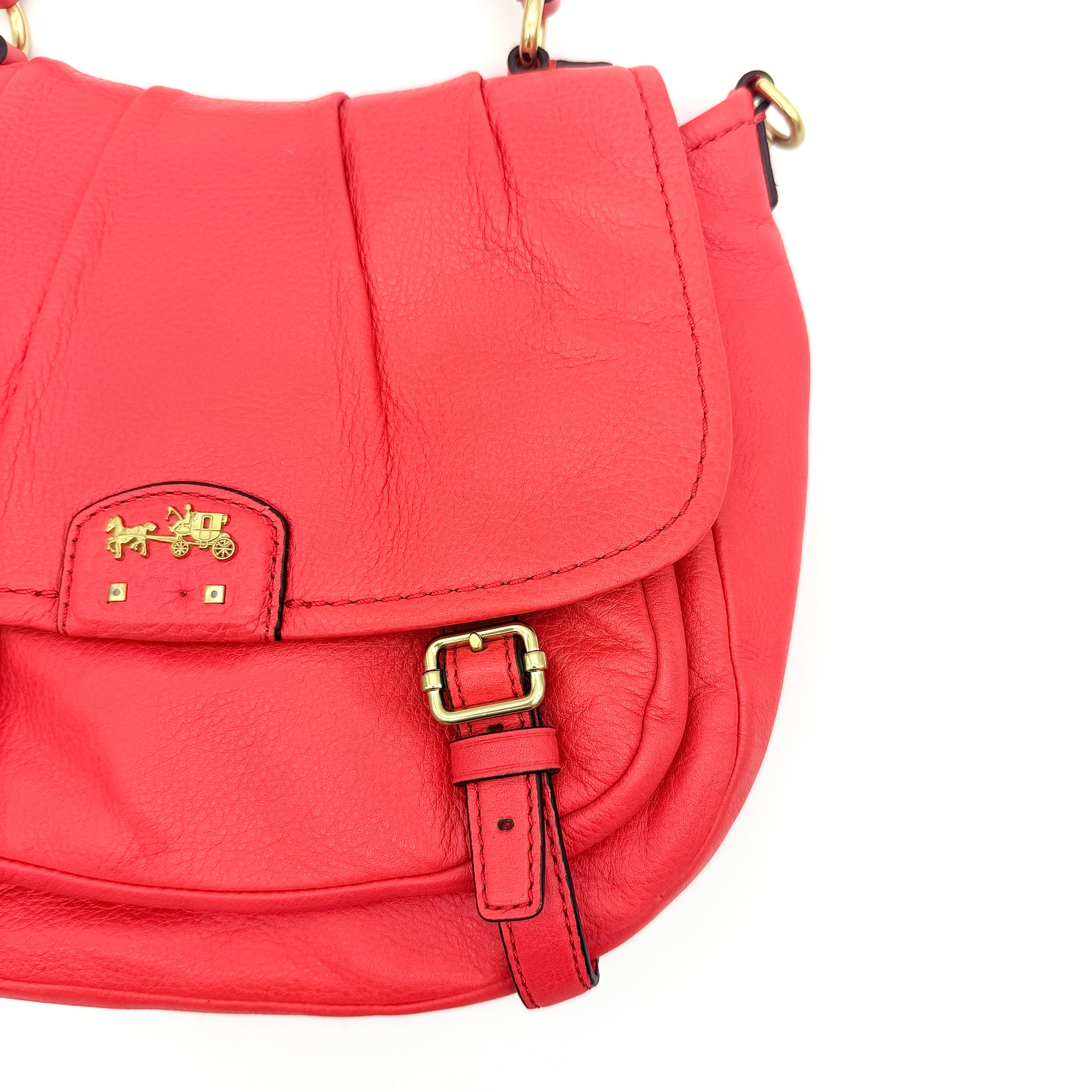 Coach Madison Anabelle red leather handbag with gold tone hardware, top handle, and detachable strap displayed on a white background