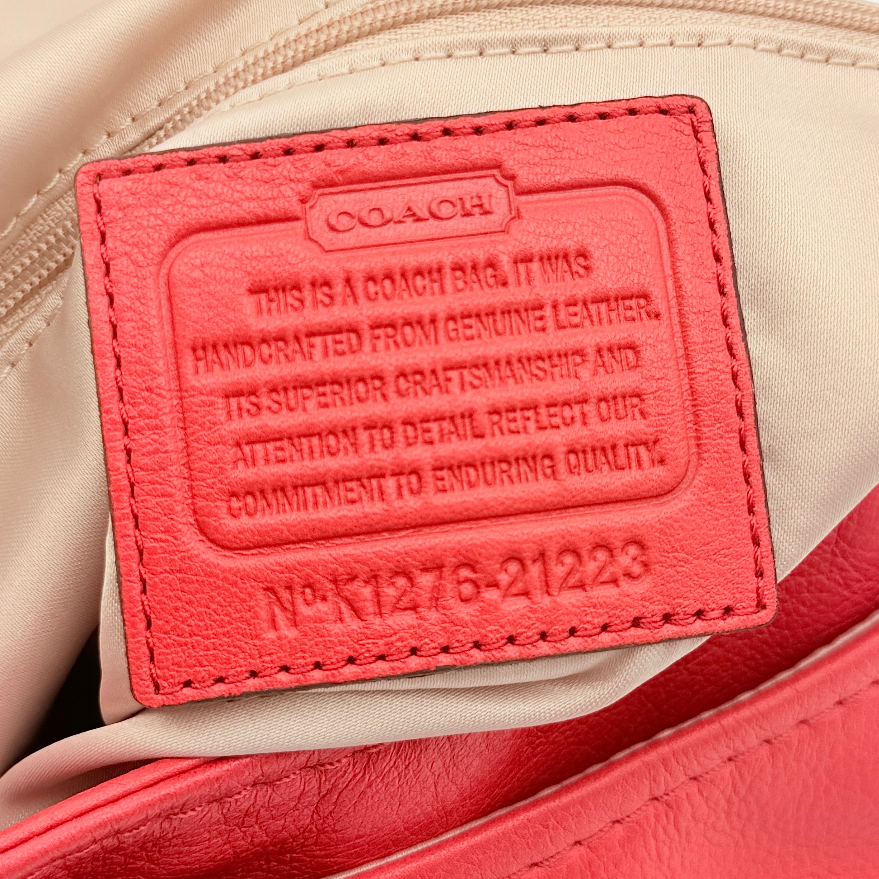 Coach Madison Anabelle red leather handbag with gold tone hardware, top handle, and detachable strap displayed on a white background
