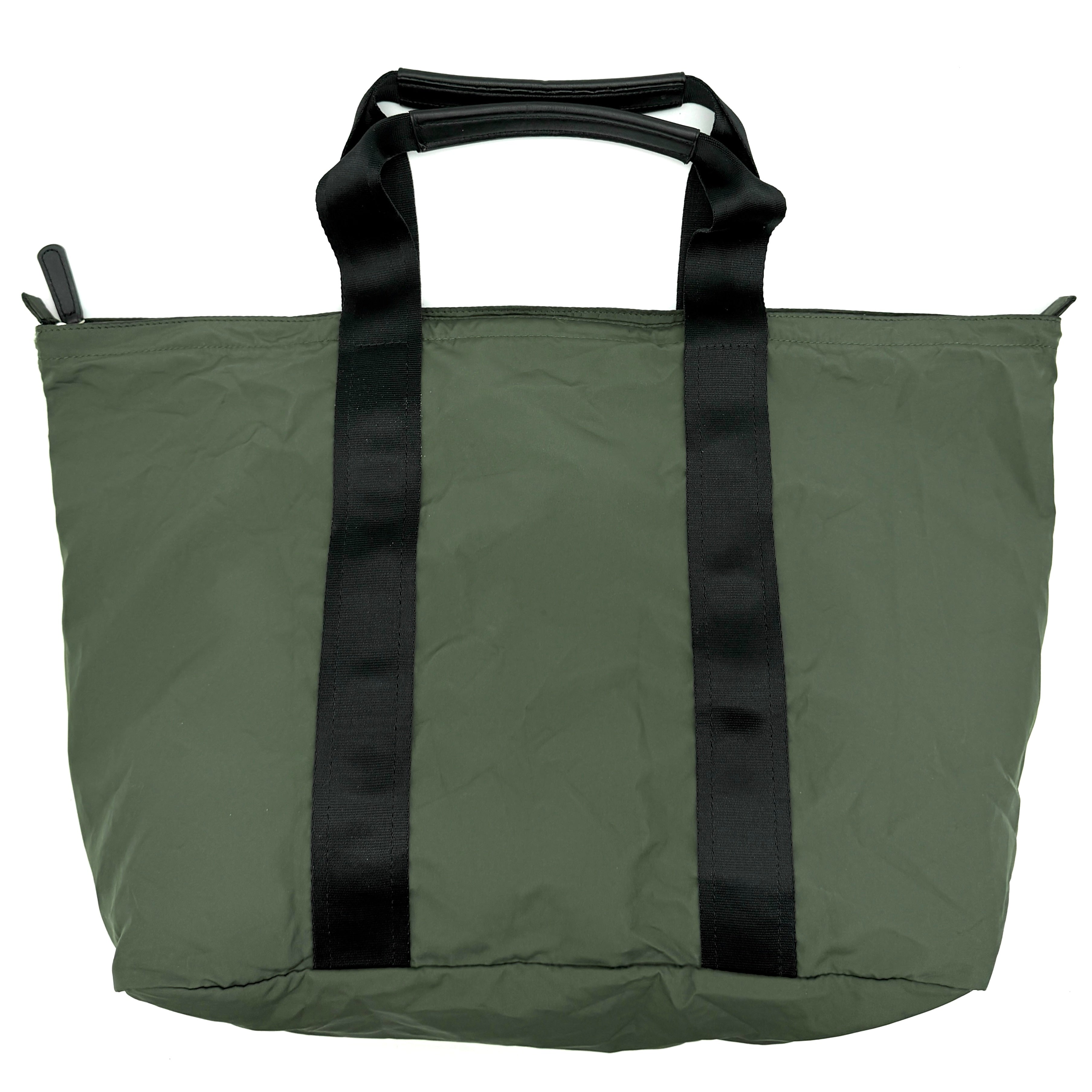 Coach Varick Packable Weekend Tote in green nylon with black web straps and a zippered external pocket.