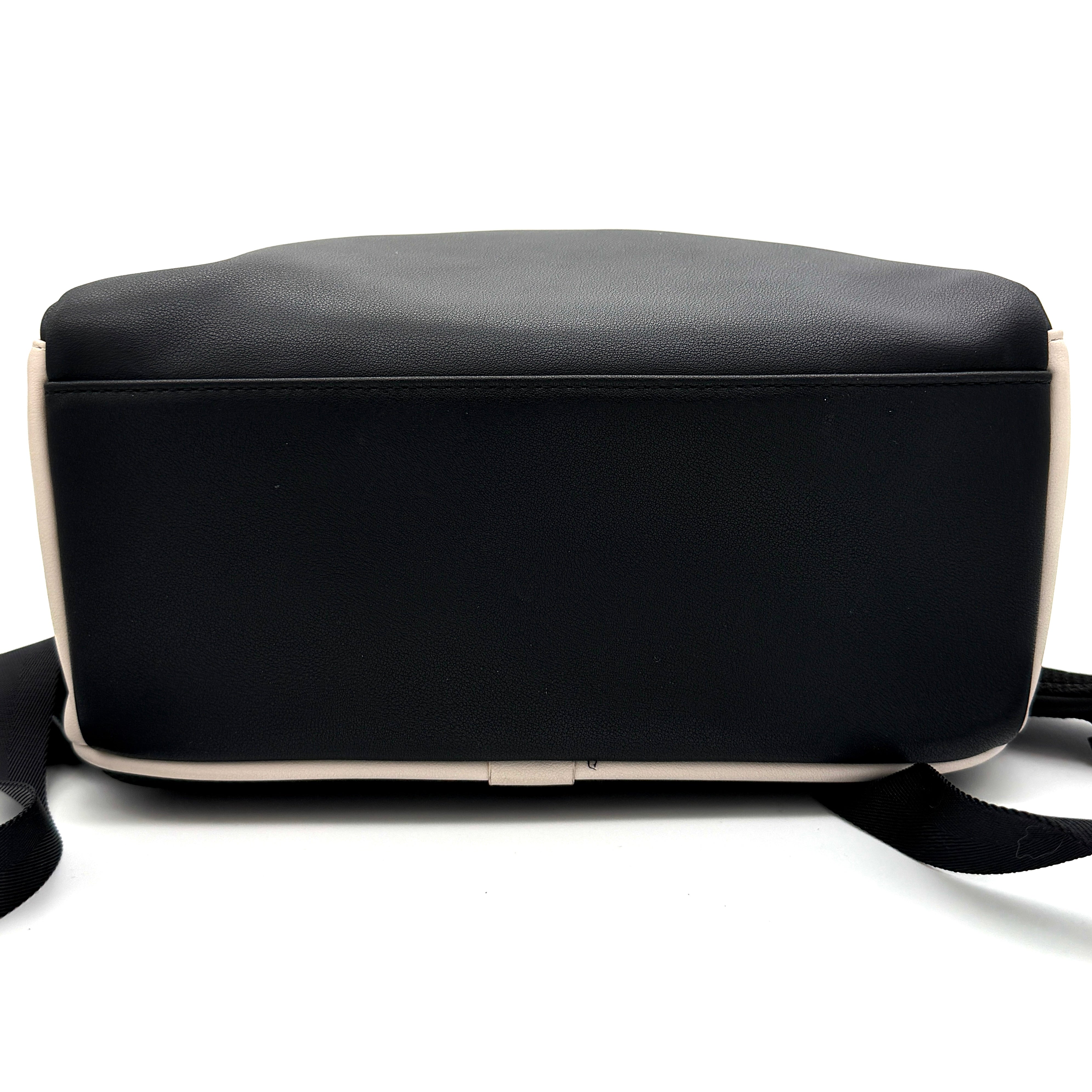 Diesel D-Logo Colorblock Backpack in black and white faux leather with a red logo patch and silver-tone hardware.