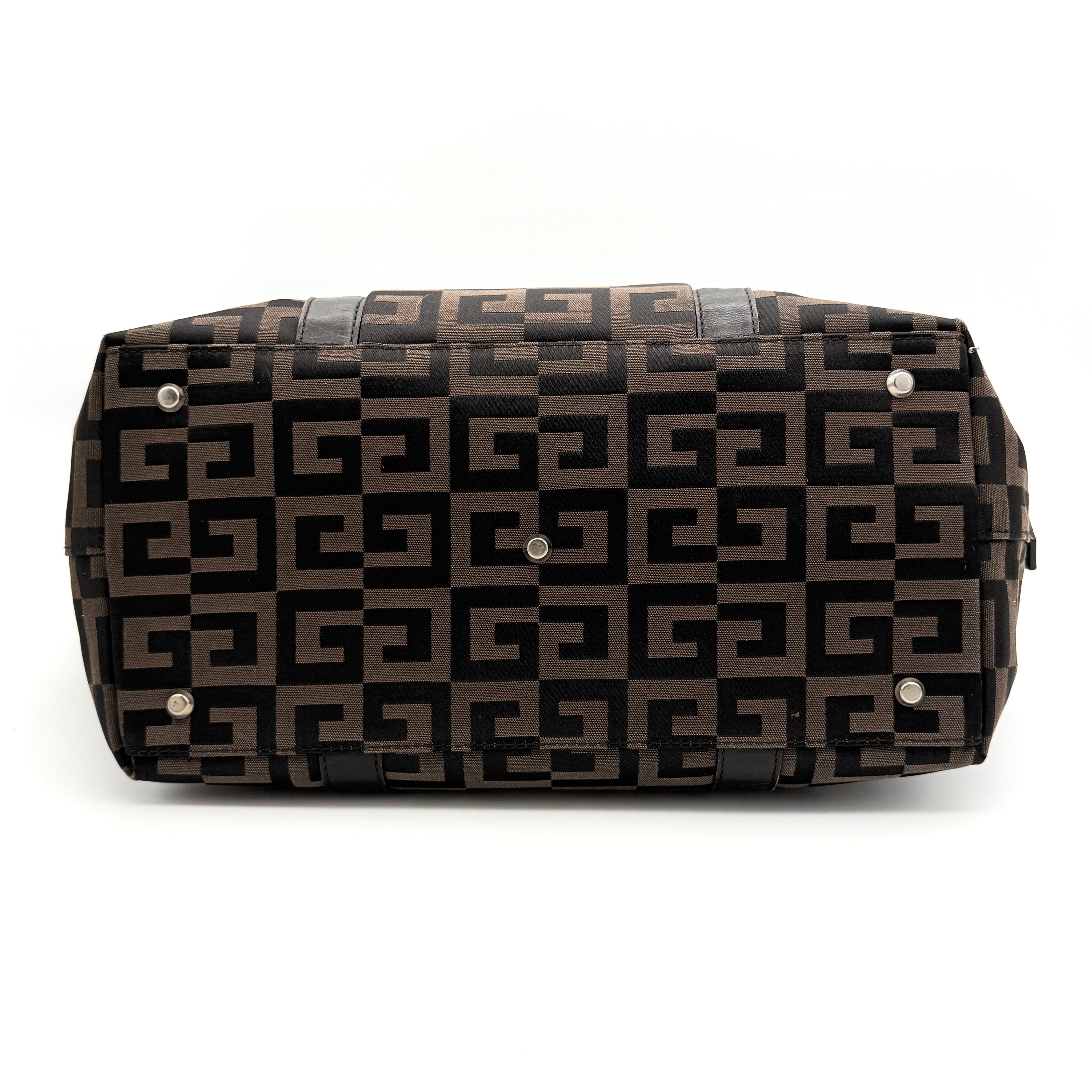 Givenchy 4G Monogram Handbag in brown and black fabric with leather handles and bold graphic pattern.