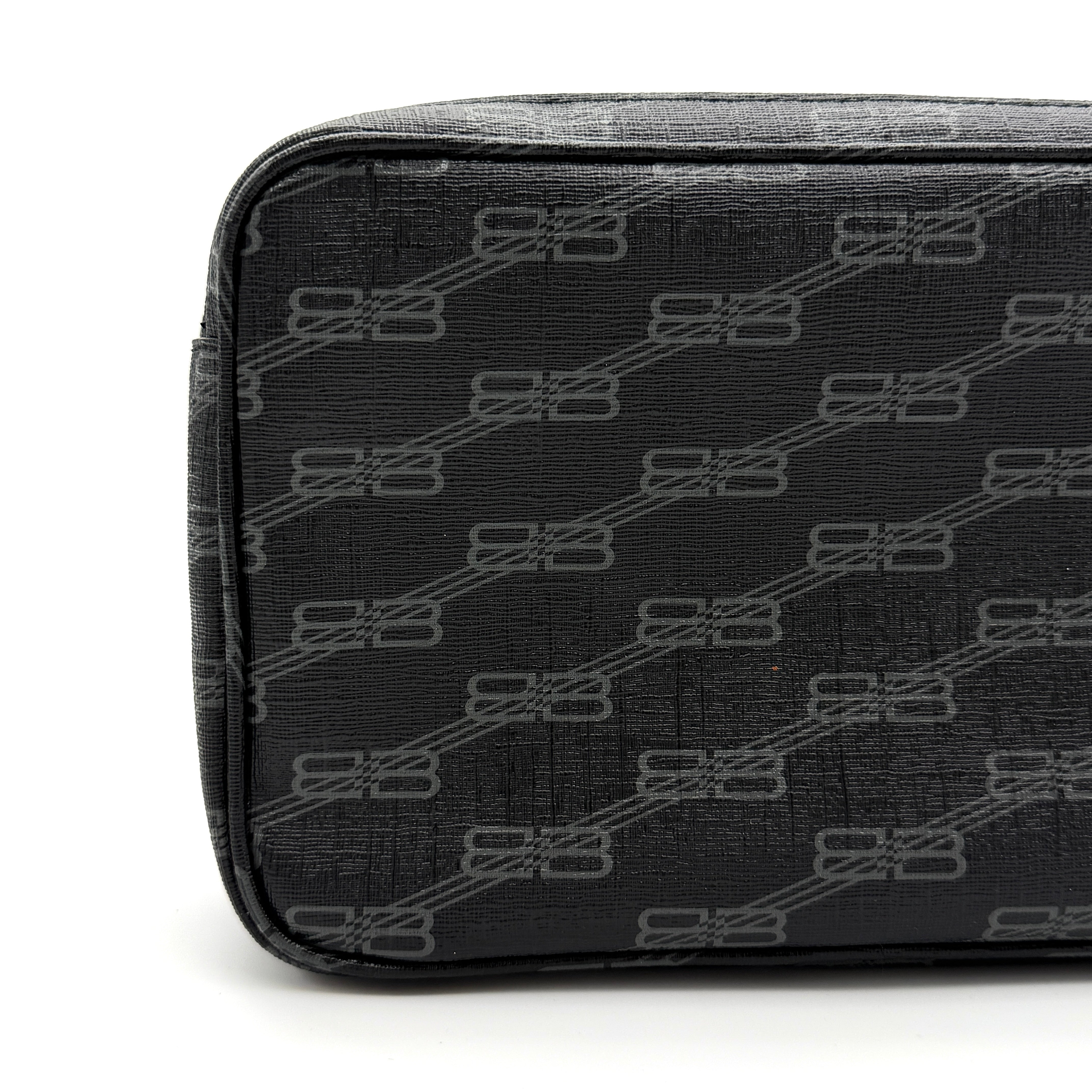 Balenciaga Signature BB Monogram Everyday Clutch Bag in black with double zip compartments and detachable wrist strap displayed on a Balenciaga dust bag.