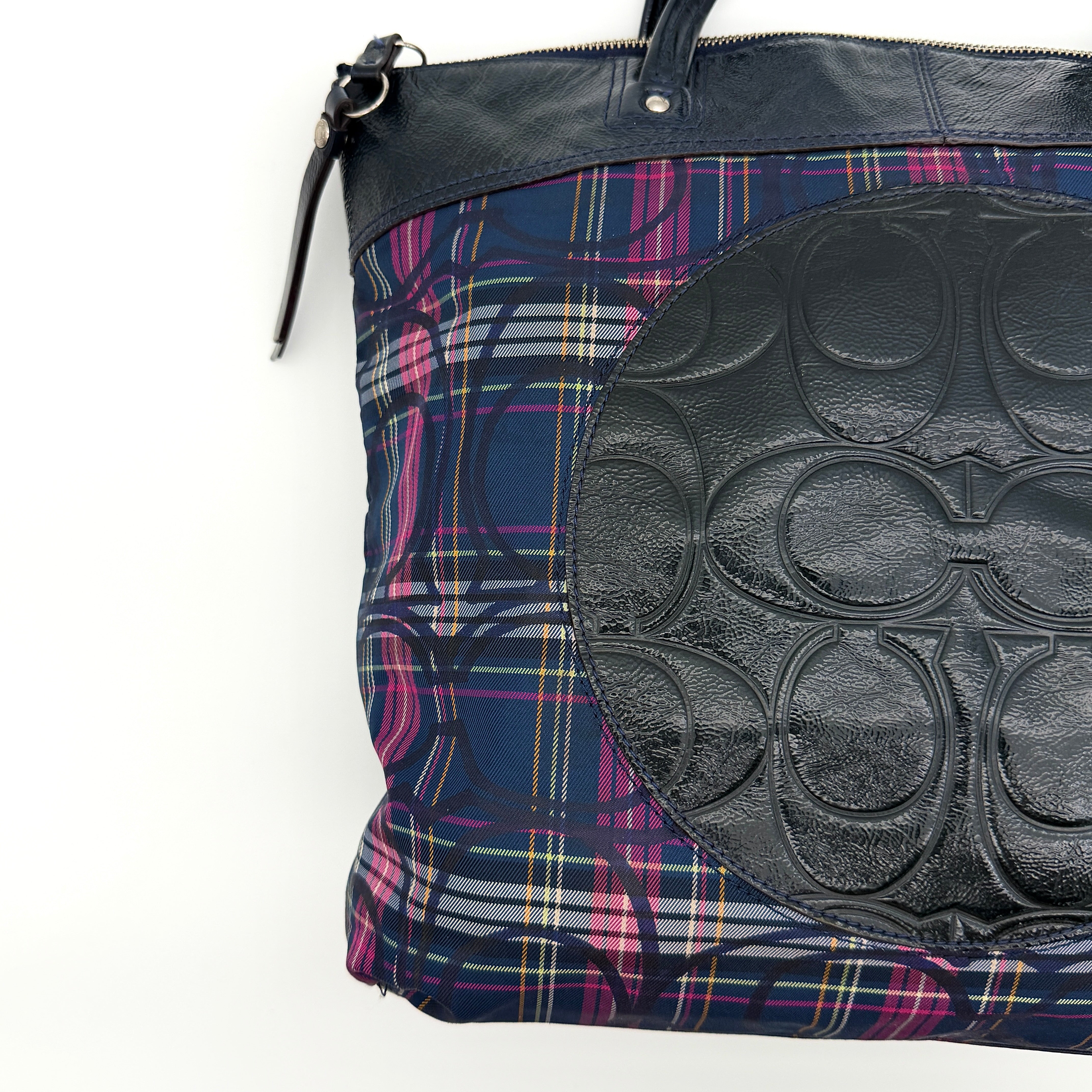Coach Signature Tartan Plaid Tote Bag in navy, pink and yellow plaid with embossed leather circle and black leather trim.