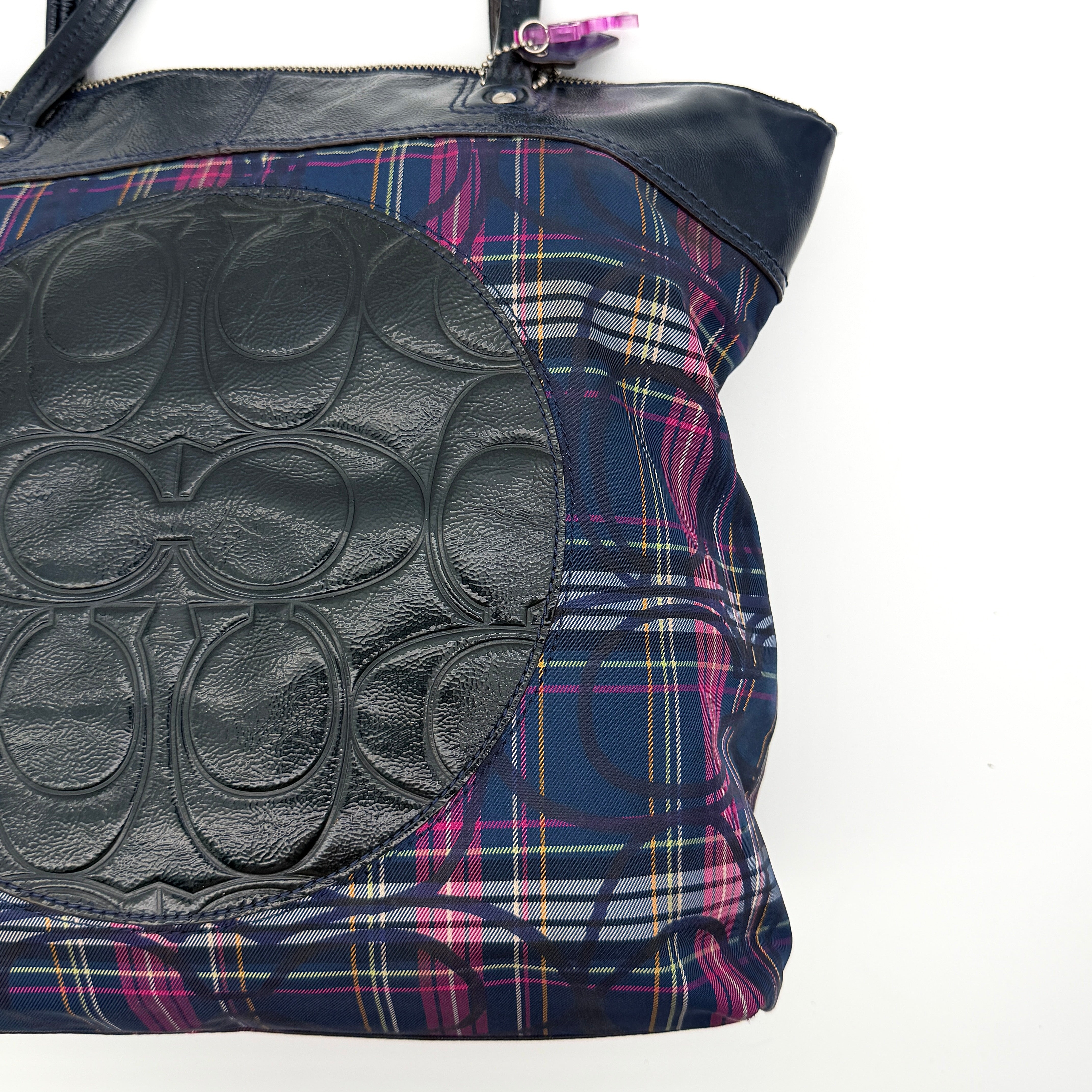 Coach Signature Tartan Plaid Tote Bag in navy, pink and yellow plaid with embossed leather circle and black leather trim.