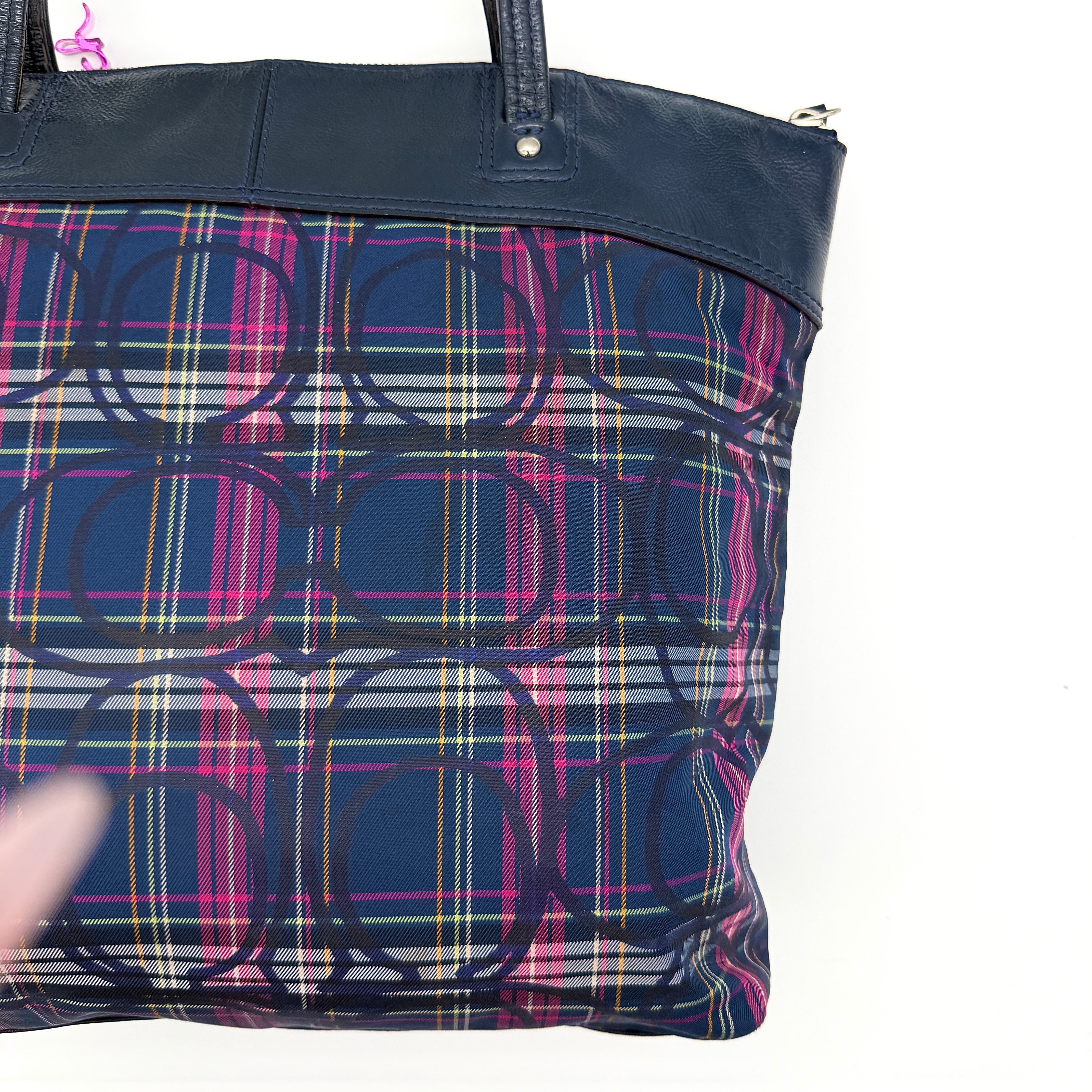 Coach Signature Tartan Plaid Tote Bag in navy, pink and yellow plaid with embossed leather circle and black leather trim.