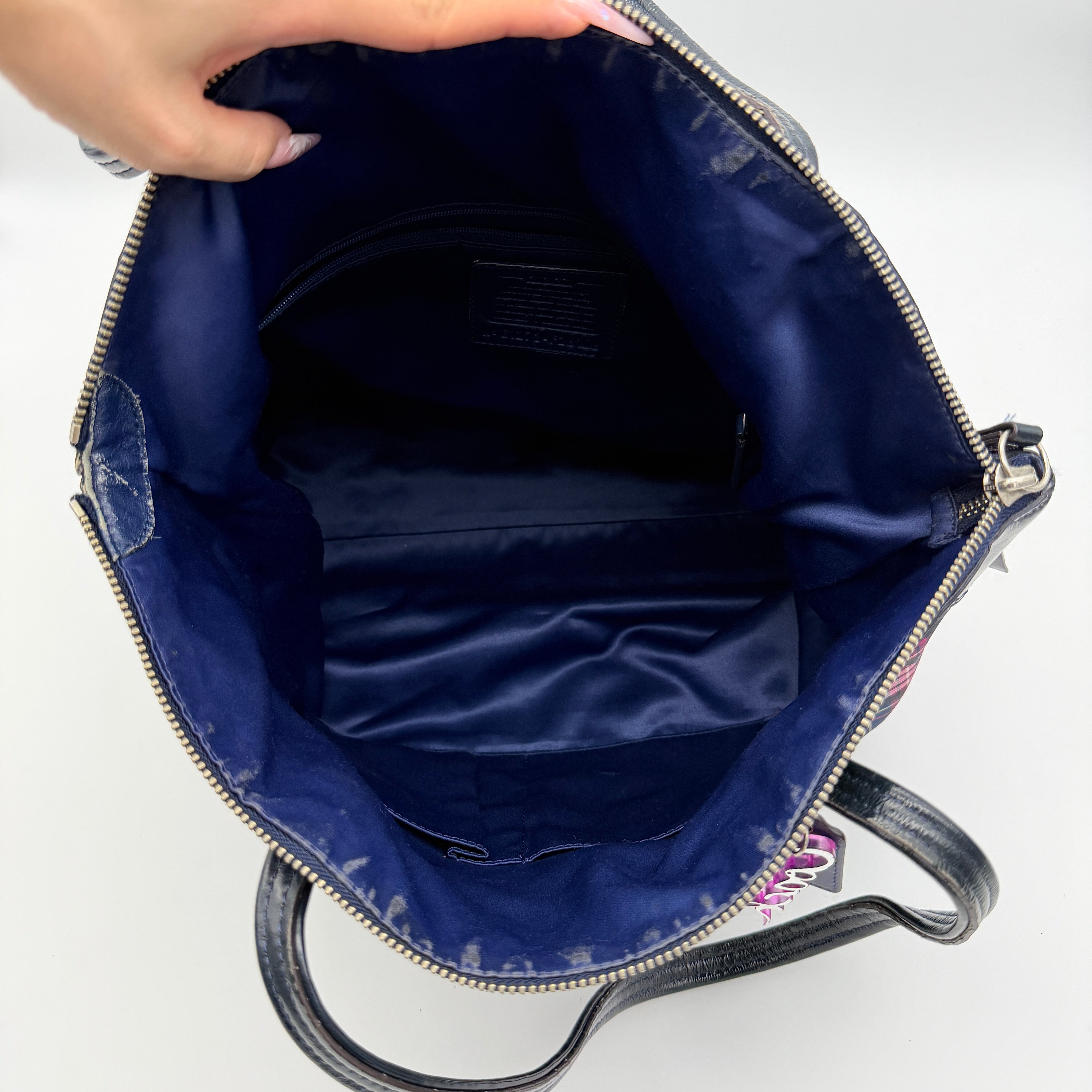 Coach Signature Tartan Plaid Tote Bag in navy, pink and yellow plaid with embossed leather circle and black leather trim.