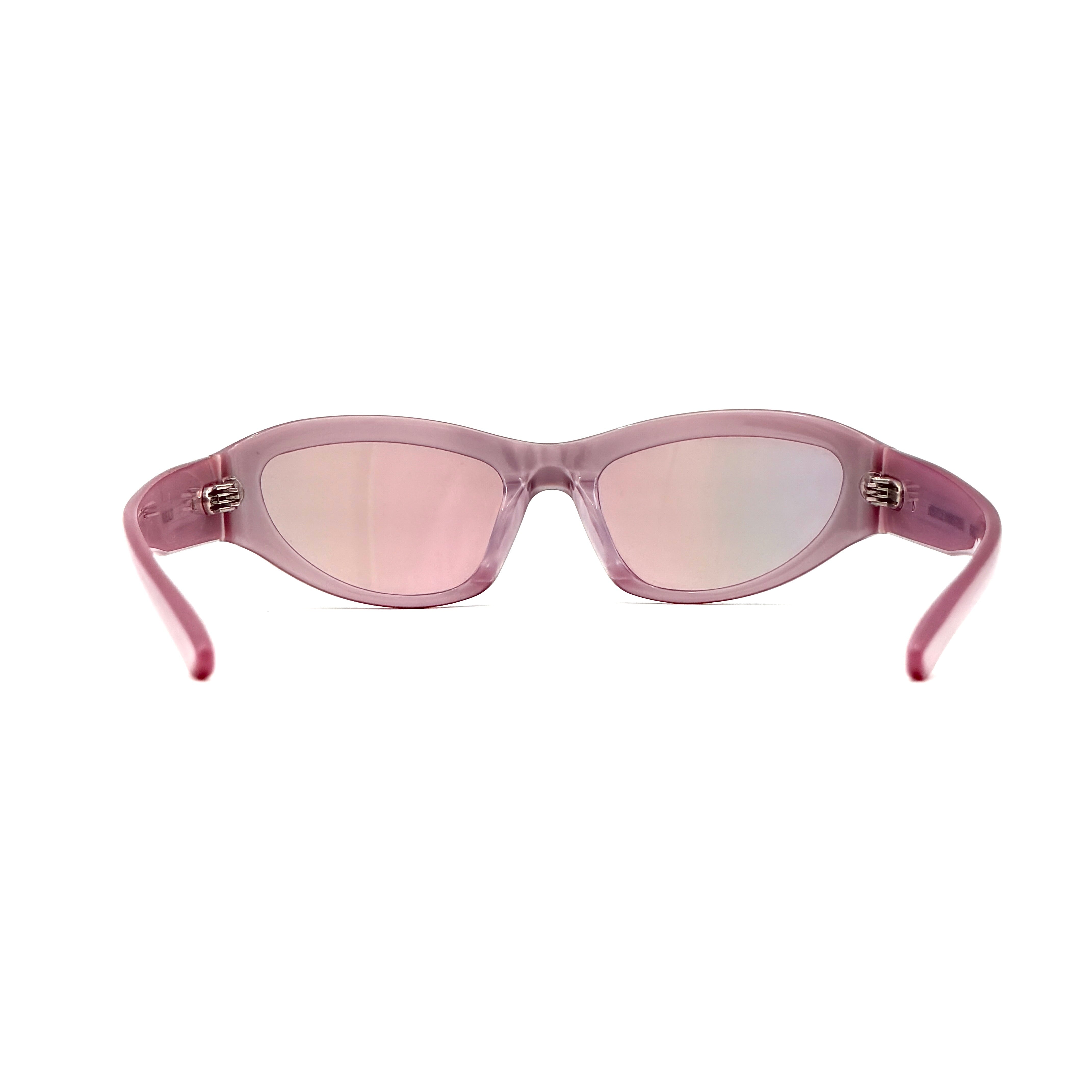 Gentle Monster R.E.A.T sunglasses in translucent pink acetate with mirrored pink lenses and silver star hardware, displayed alongside a chrome hard case.