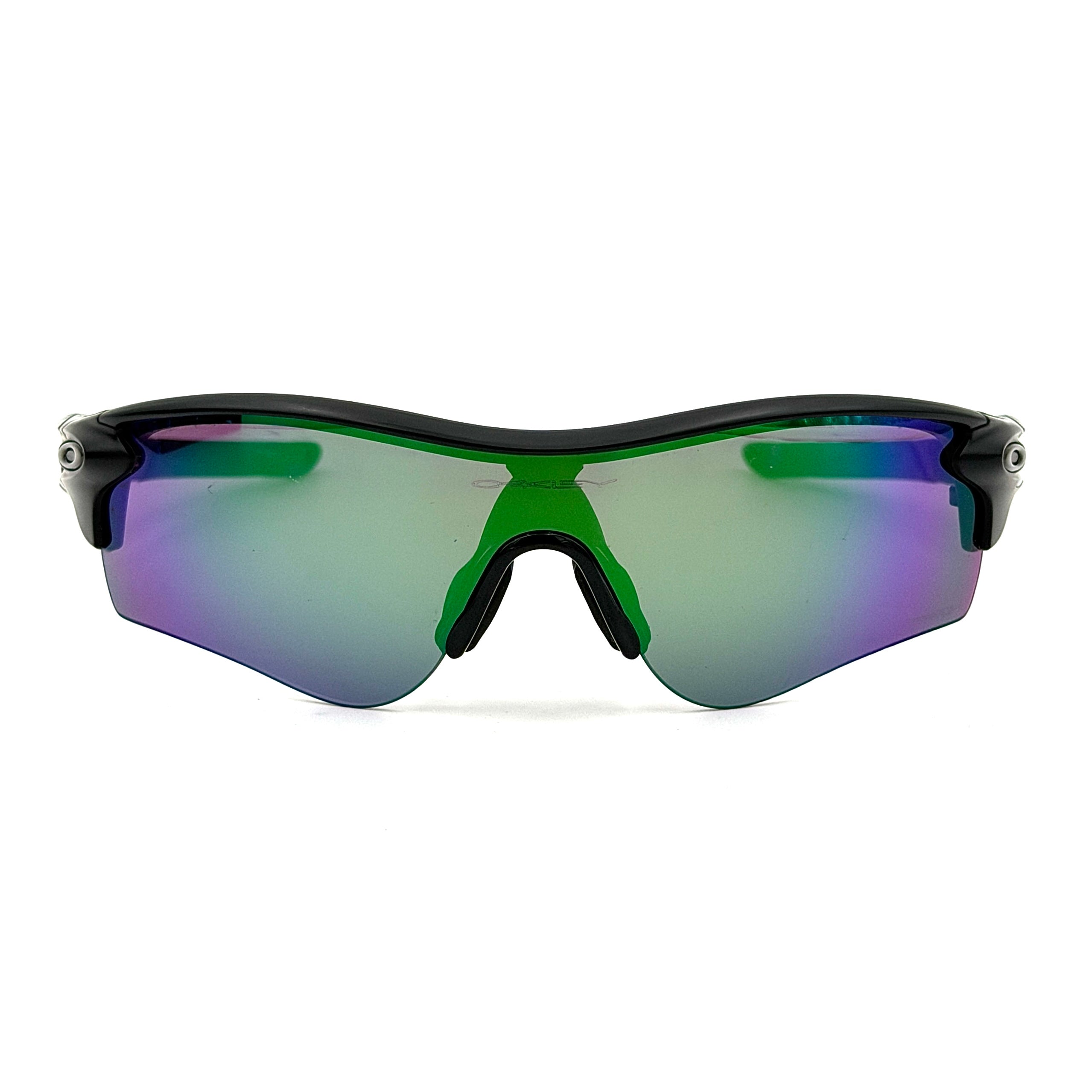 Oakley RadarLock Path sunglasses in matte black with reflective green and violet Prizm shield lens, presented with original black case, box, and cloth.