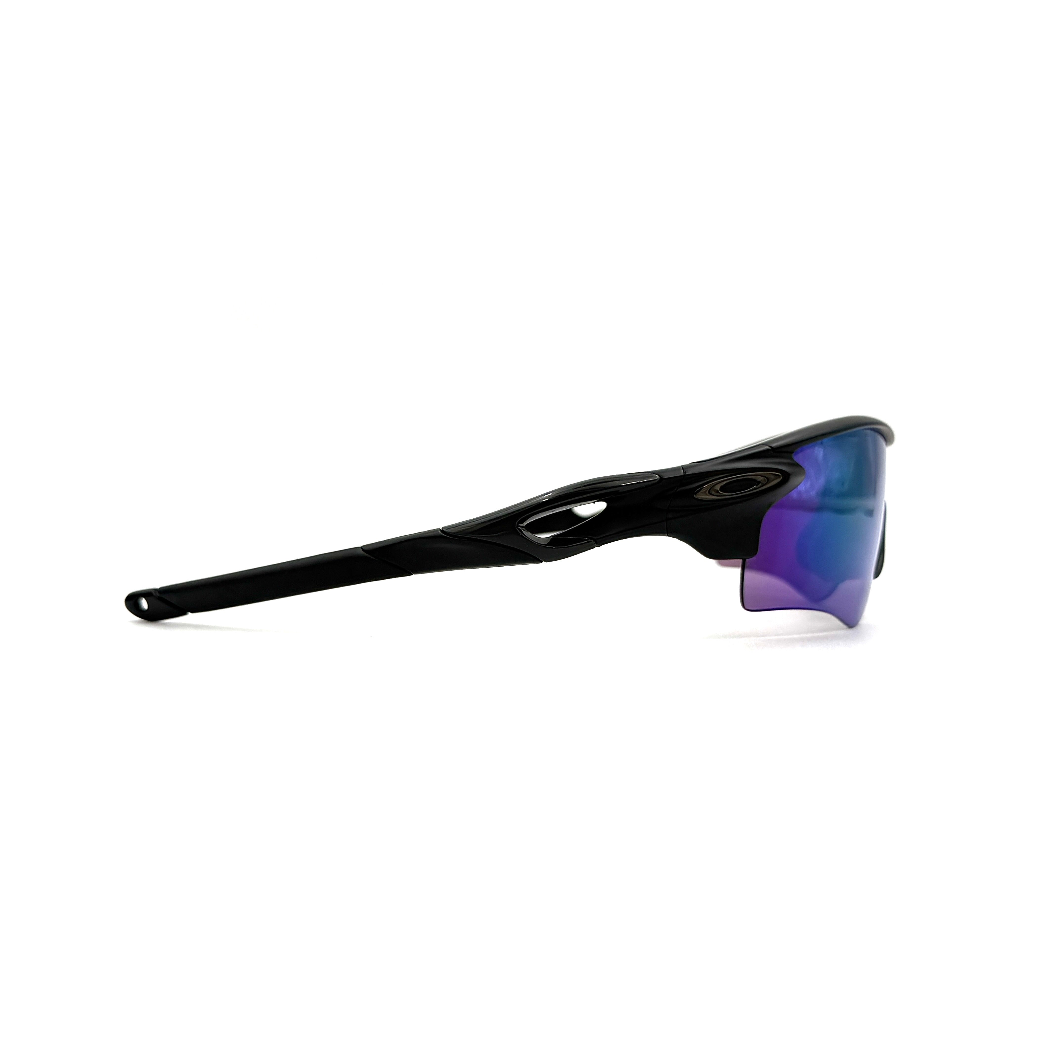 Oakley RadarLock Path sunglasses in matte black with reflective green and violet Prizm shield lens, presented with original black case, box, and cloth.