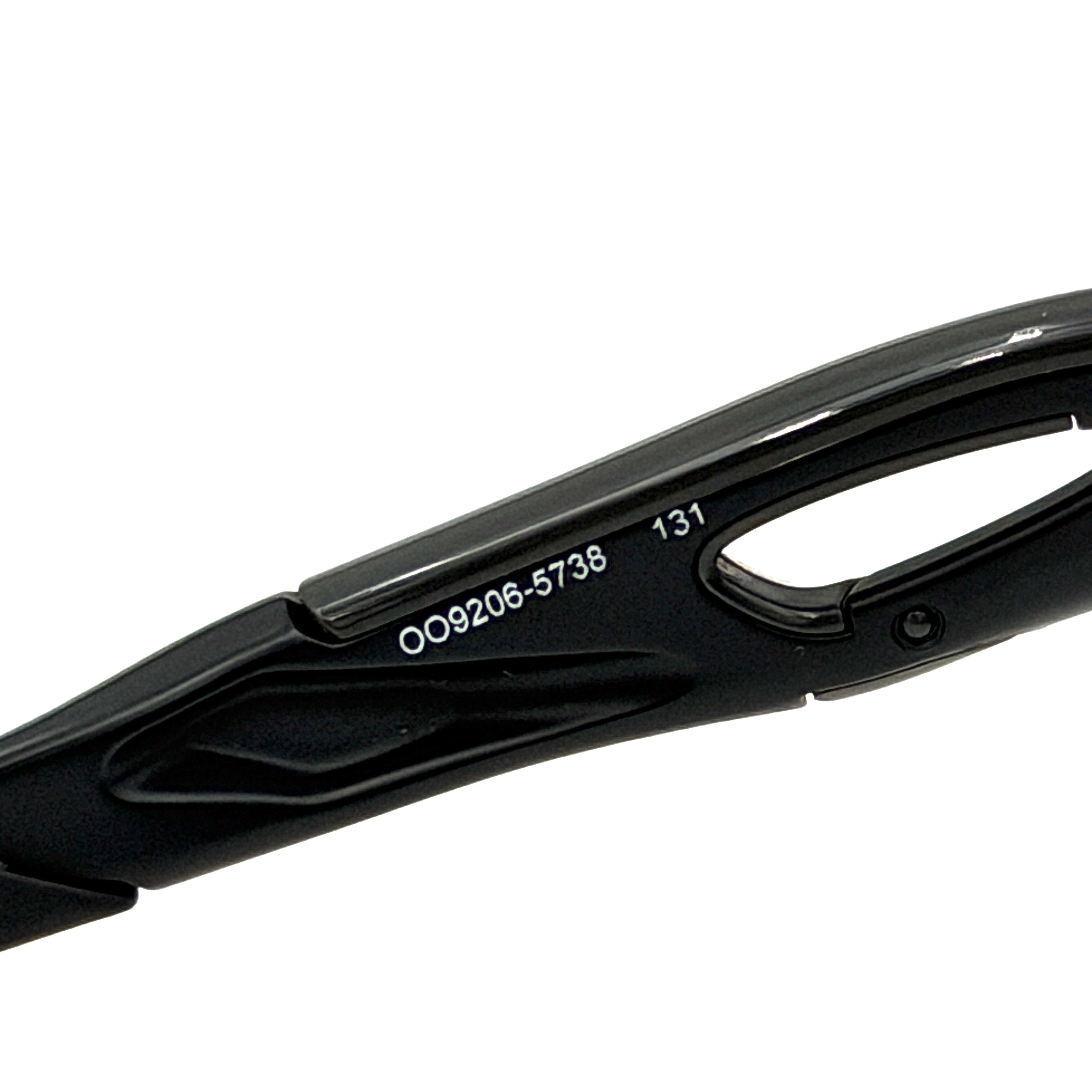 Oakley RadarLock Path sunglasses in matte black with reflective green and violet Prizm shield lens, presented with original black case, box, and cloth.