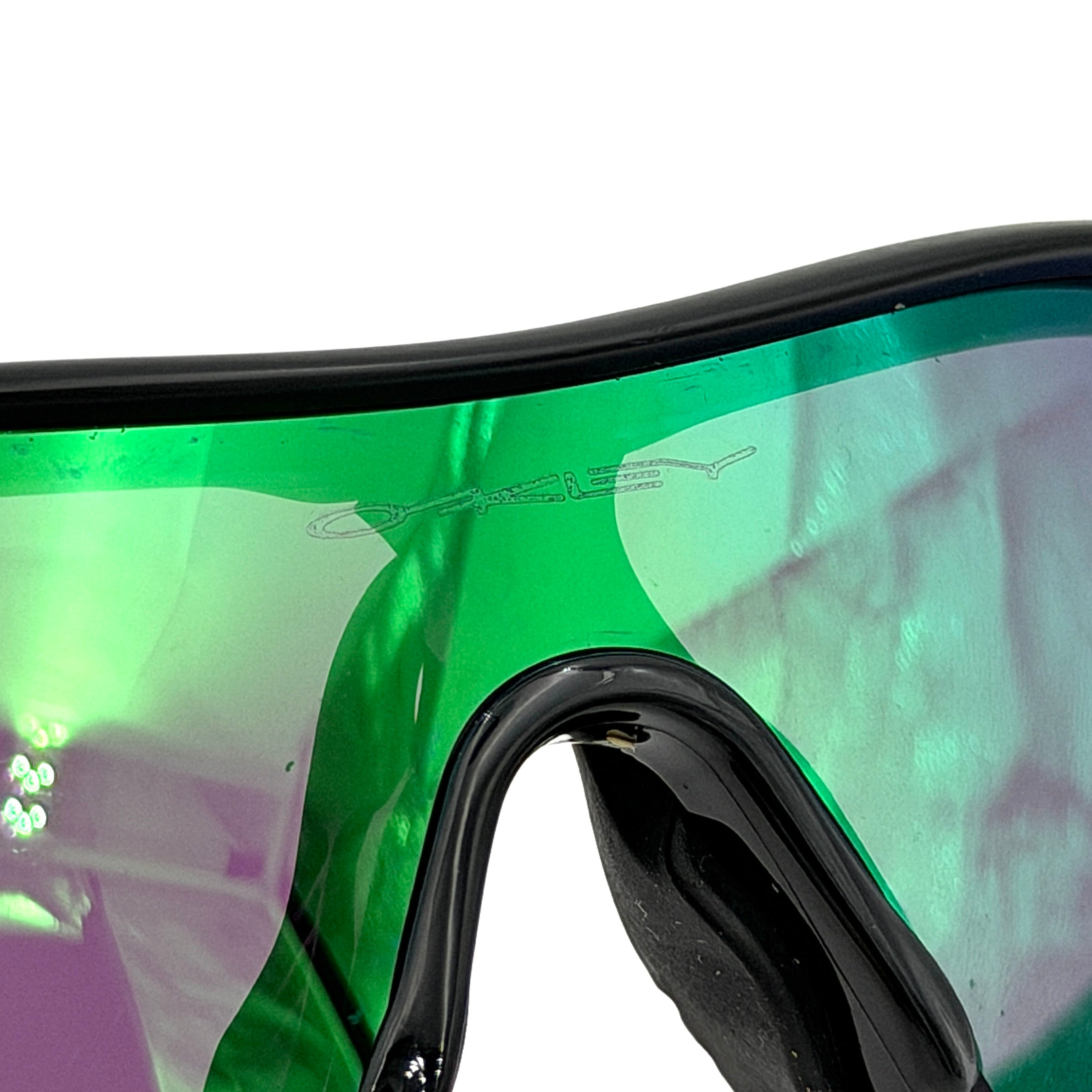 Oakley RadarLock Path sunglasses in matte black with reflective green and violet Prizm shield lens, presented with original black case, box, and cloth.