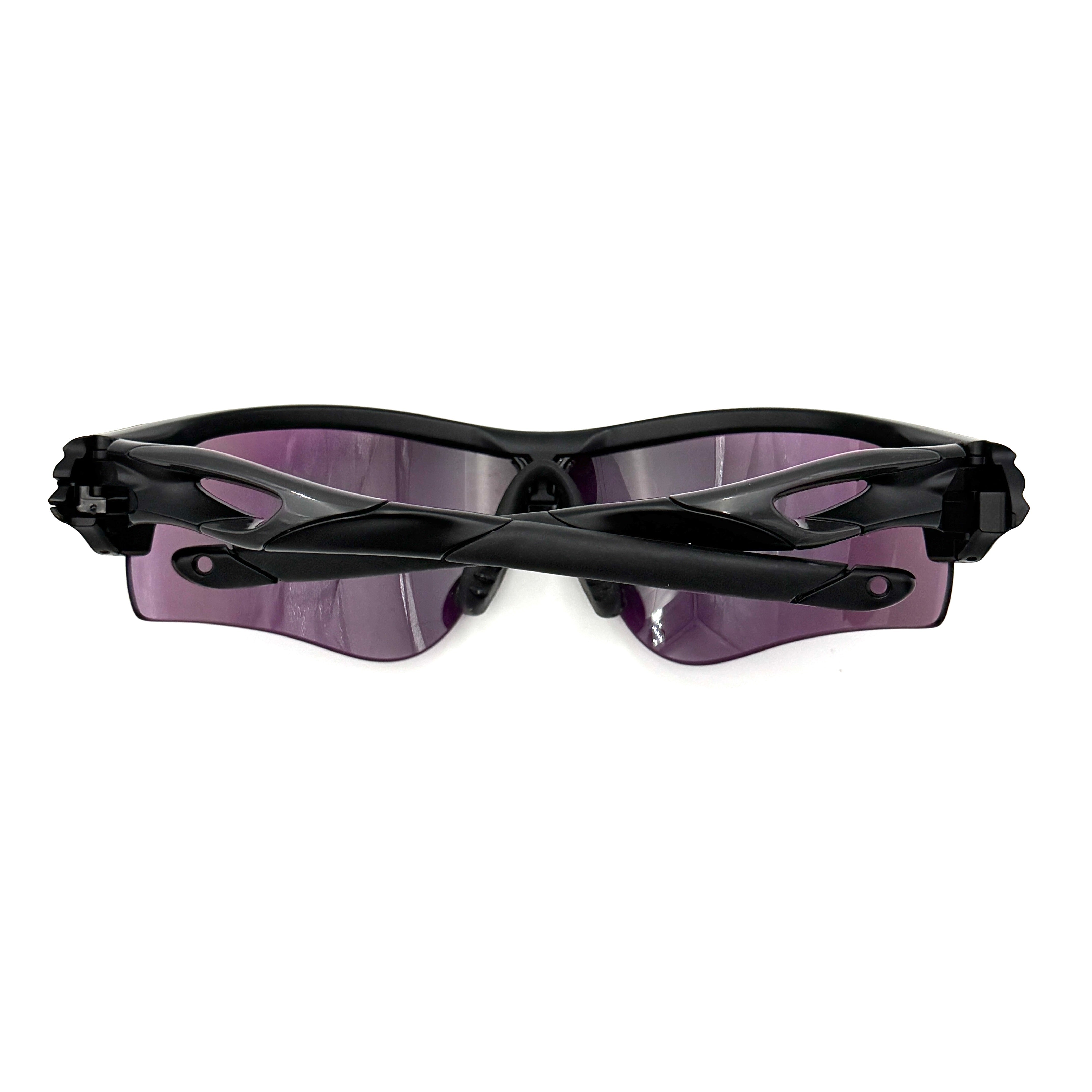 Oakley RadarLock Path sunglasses in matte black with reflective green and violet Prizm shield lens, presented with original black case, box, and cloth.