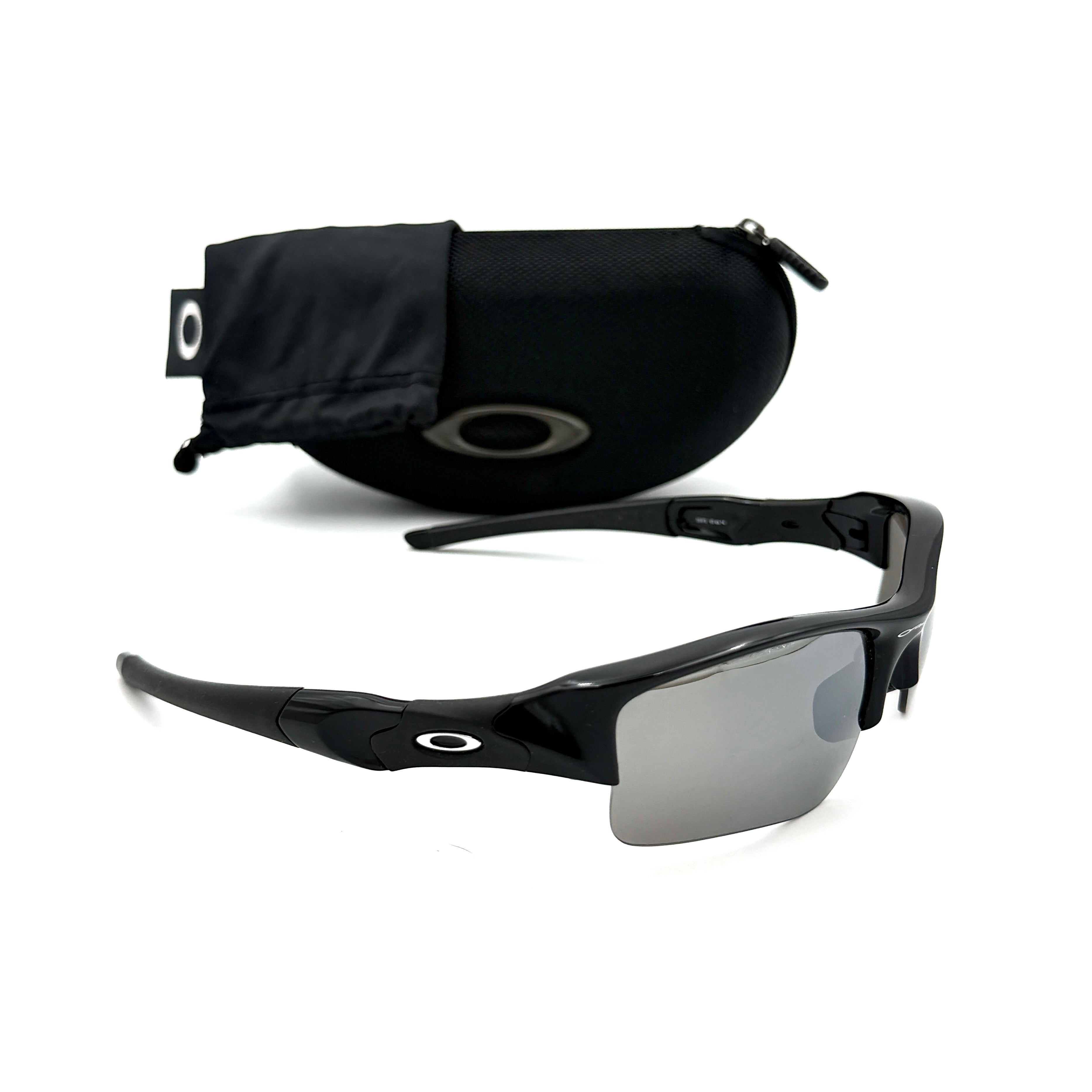 Oakley FLAK Jacket 03-915 sunglasses in black with grey lenses, shown with original zip case.
