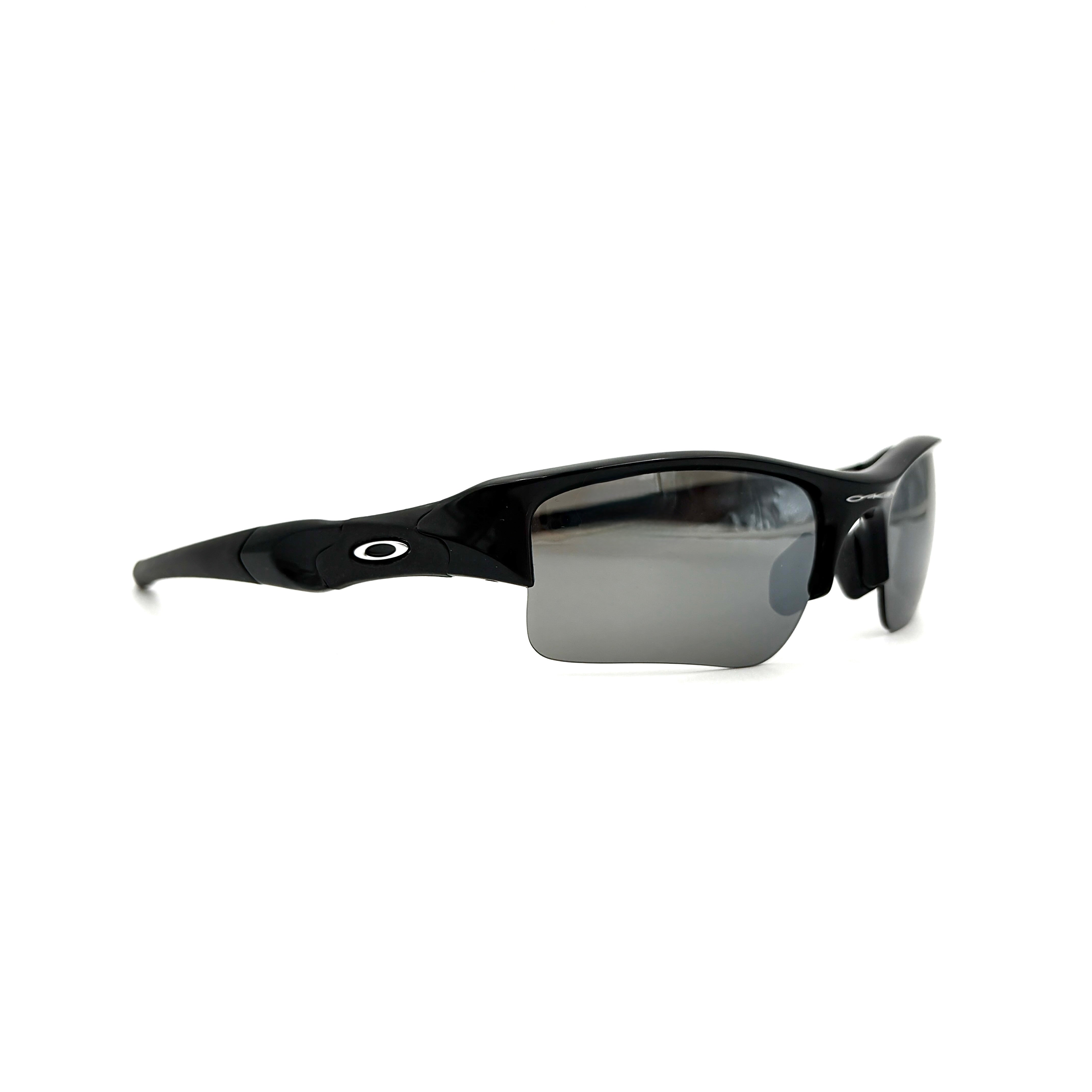 Oakley FLAK Jacket 03-915 sunglasses in black with grey lenses, shown with original zip case.