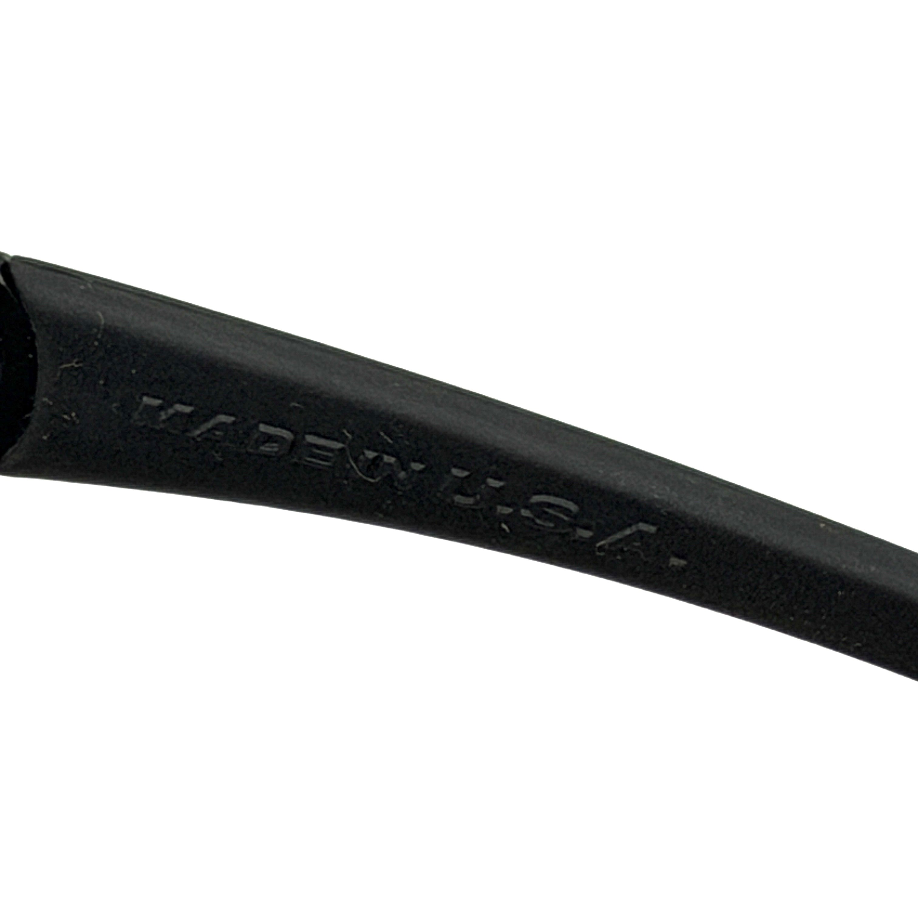Oakley FLAK Jacket 03-915 sunglasses in black with grey lenses, shown with original zip case.
