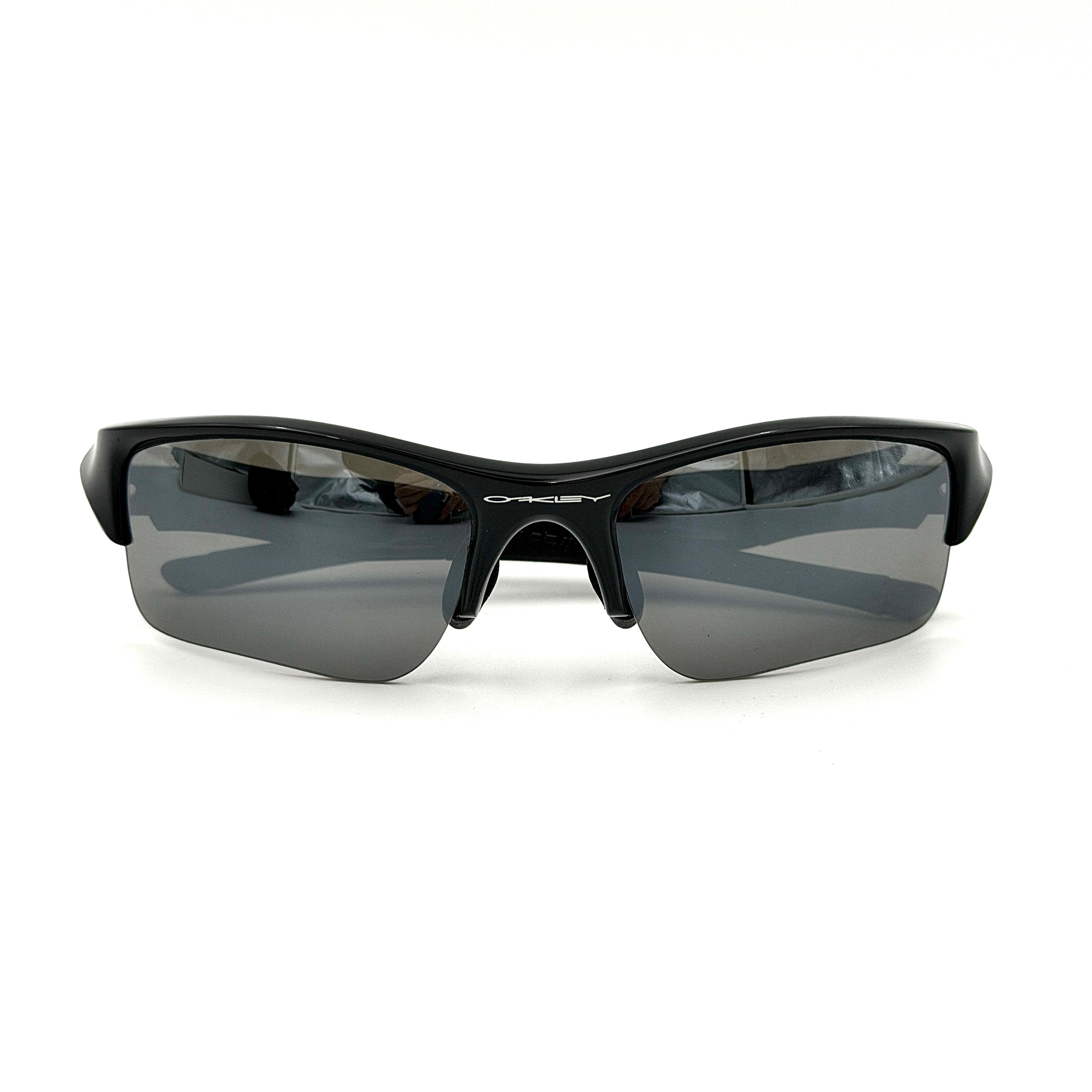 Oakley FLAK Jacket 03-915 sunglasses in black with grey lenses, shown with original zip case.