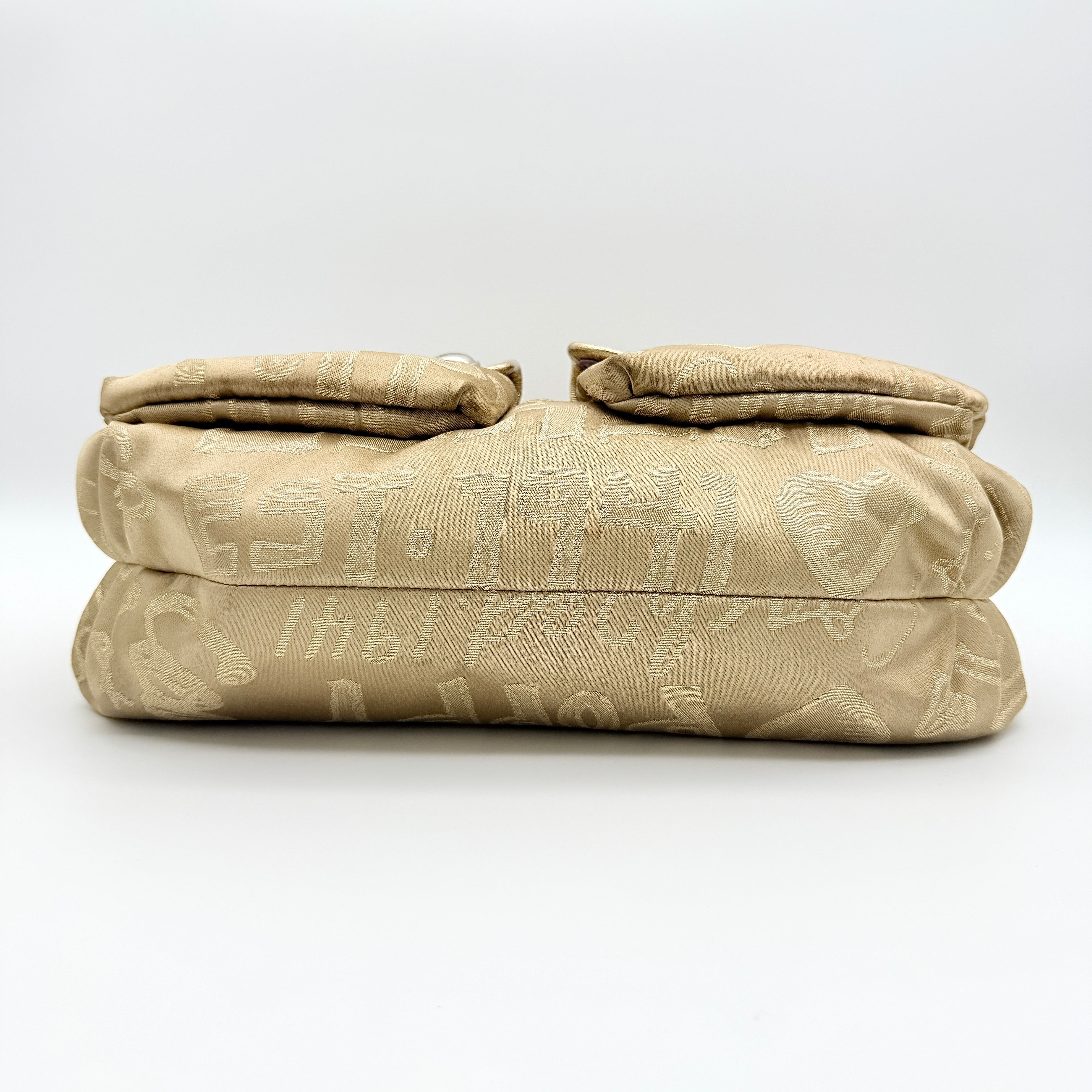Coach Signature Poppy Pocket Hobo in beige sateen with metallic gold trim and silver hardware, shown with detachable strap.