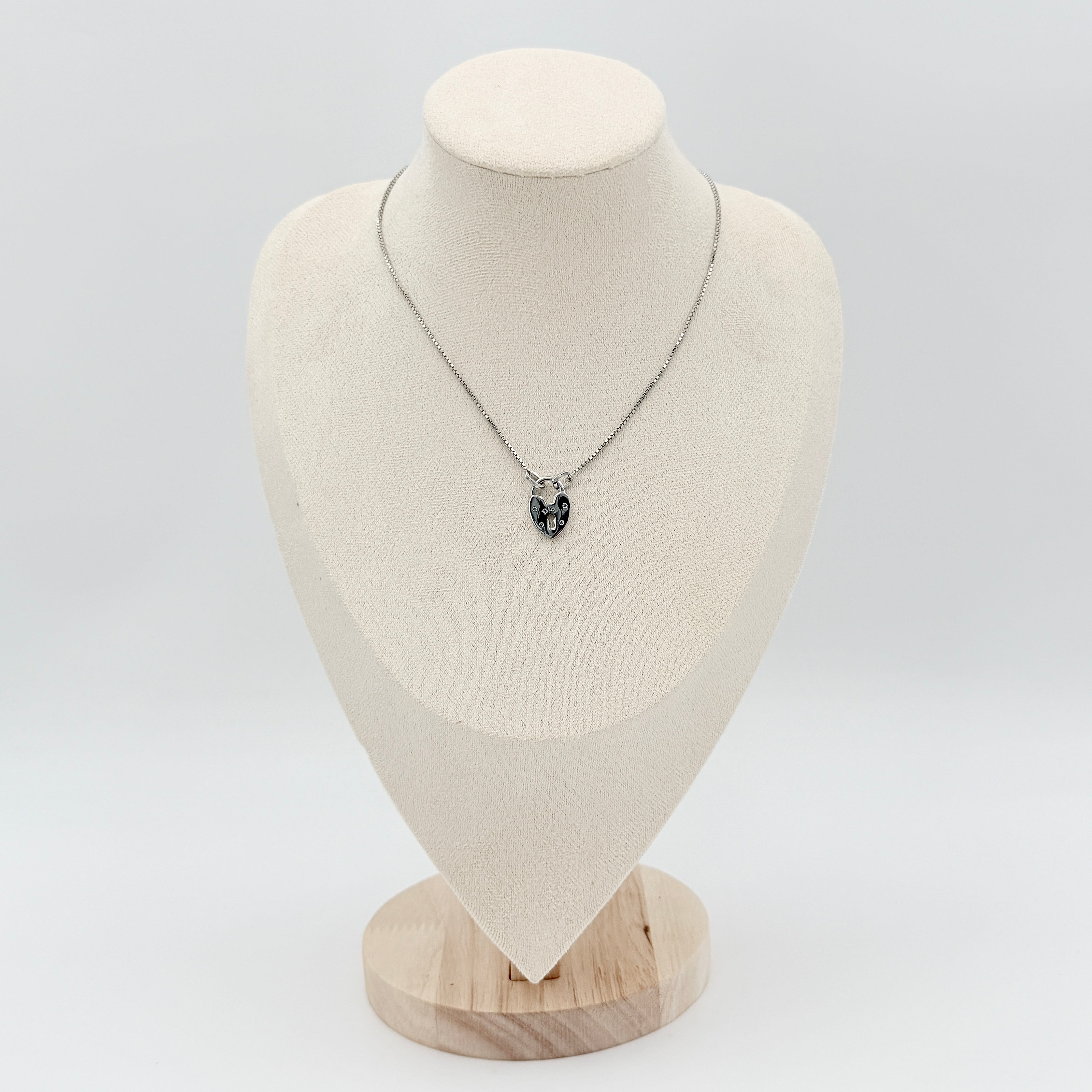 Dior Heart Padlock Necklace in polished silver-tone metal, featuring a heart-shaped padlock pendant on a slender box chain.