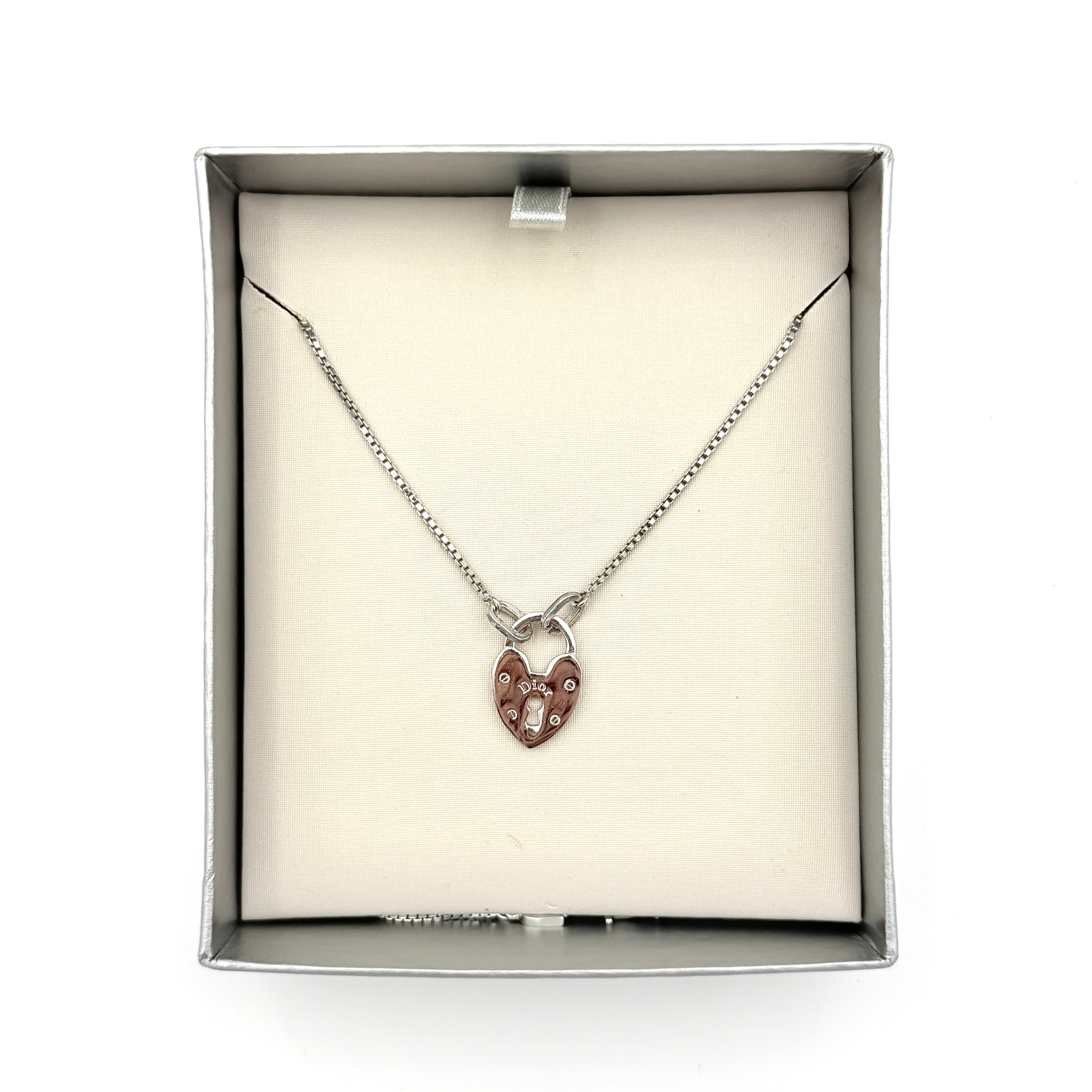 Dior Heart Padlock Necklace in polished silver-tone metal, featuring a heart-shaped padlock pendant on a slender box chain.