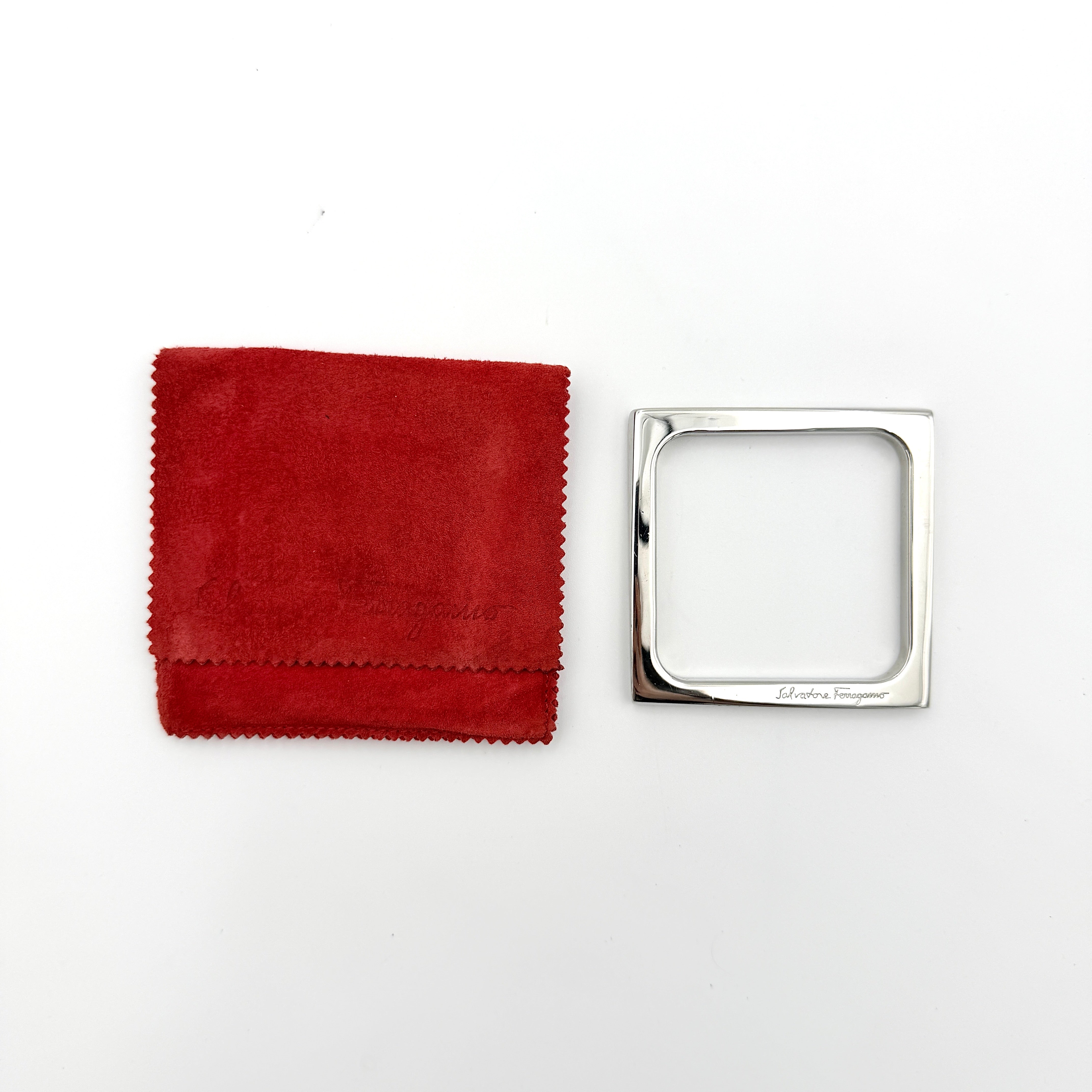 Salvatore Ferragamo square silver bangle bracelet with a crisp, minimalist silhouette and engraved logo.