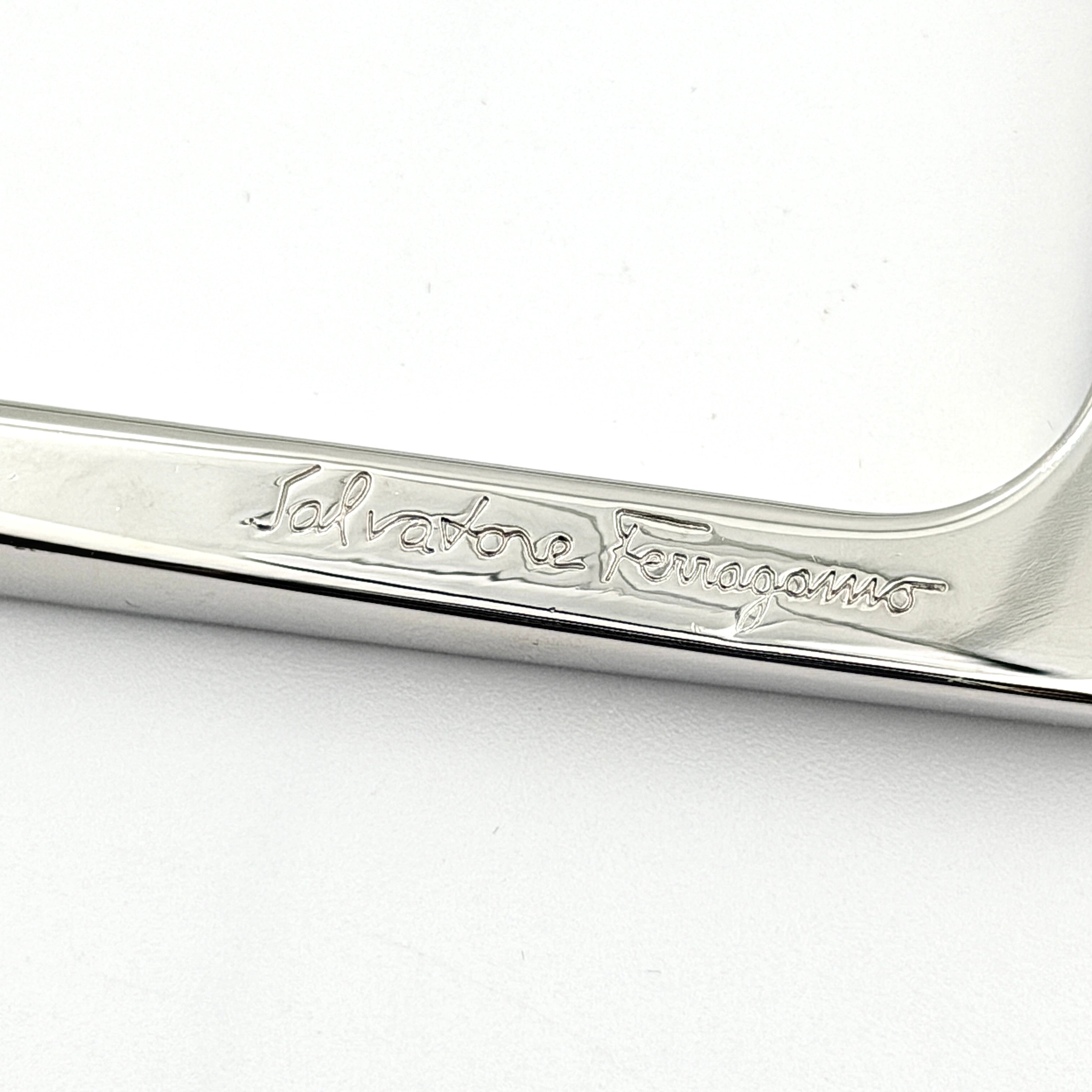 Salvatore Ferragamo square silver bangle bracelet with a crisp, minimalist silhouette and engraved logo.