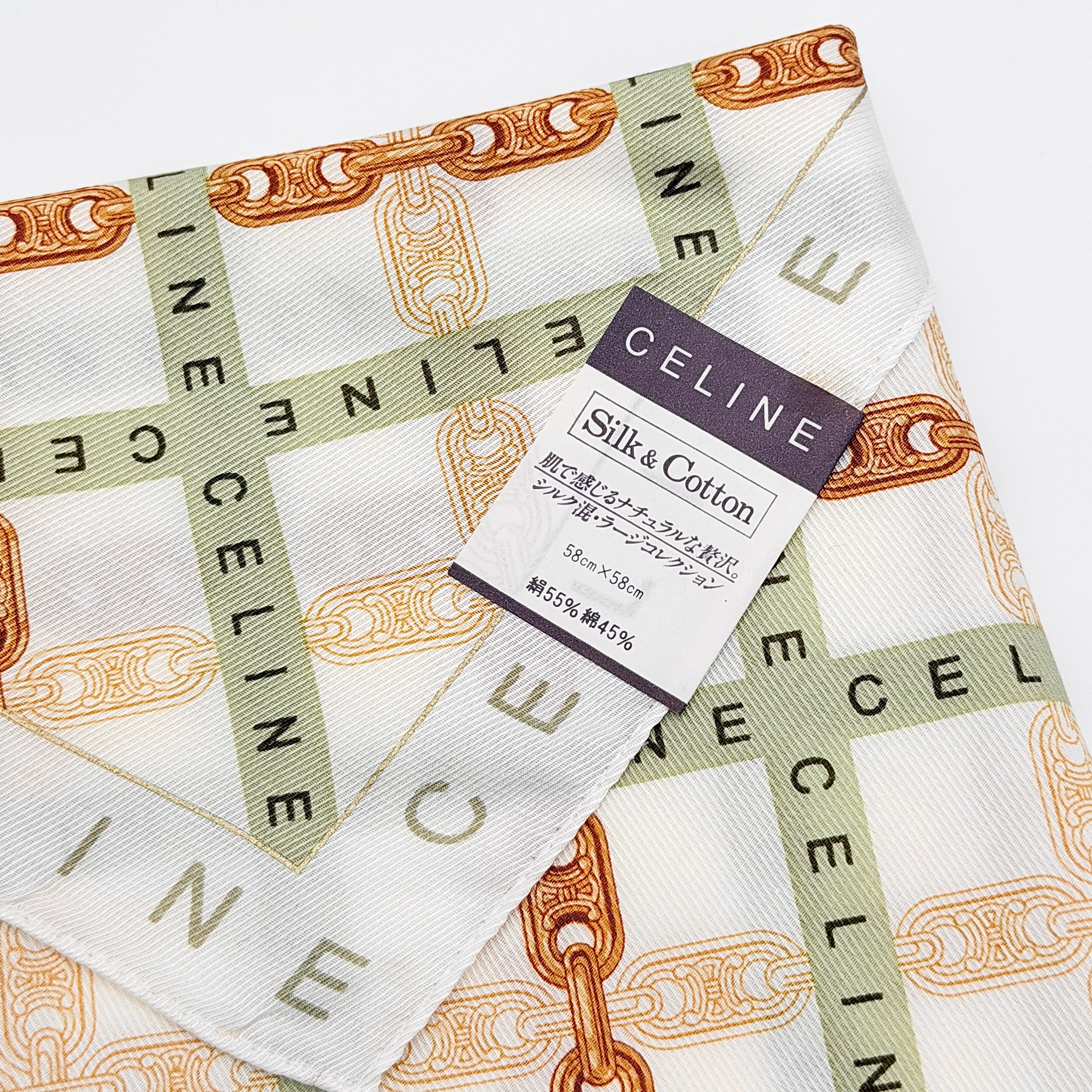 Celine silk and cotton scarf in green and gold chain motif with logo border, displayed with original box.